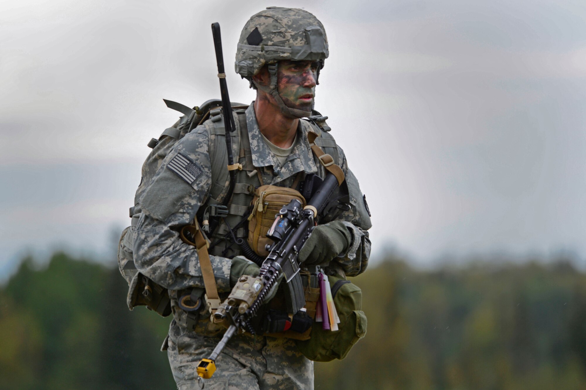 A paratrooper assigned to the 1st Battalion, 501st Parachute Infantry Regiment, 4th Infantry Brigade Combat Team (Airborne), 25th Infantry Division, U.S. Army Alaska, participates in a joint forcible entry exercise at Malemute Drop Zone on Joint Base Elmendorf-Richardson, Alaska, Aug. 23, 2016, as part of Exercise Spartan Agoge. Spartan Agoge is a brigade-level field training exercise that began Aug. 15, and focuses on an array of combat-related tasks from squad live-fire exercises to helicopter air insertion and airborne assault training. (U.S. Air Force photo by Airman 1st Class Valerie Monroy)