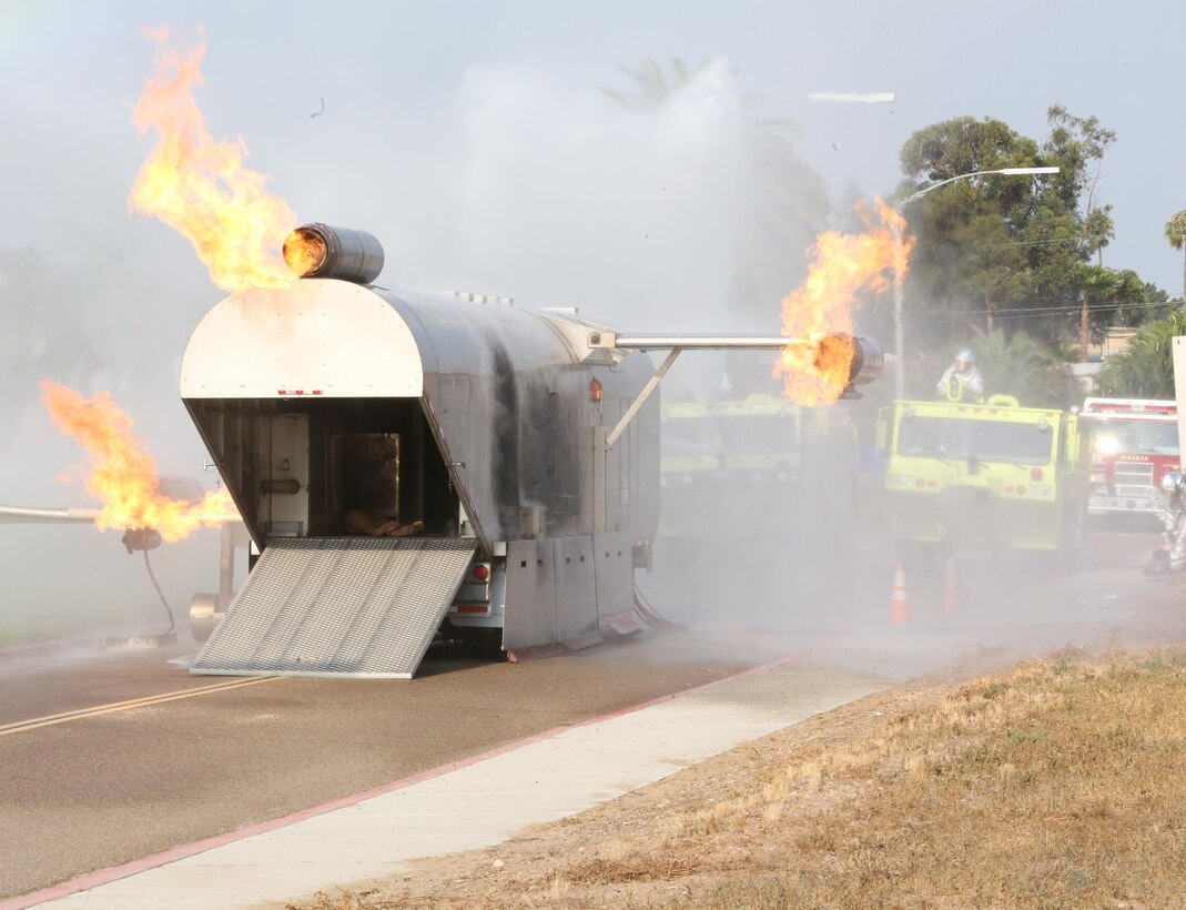 Marines with Aircraft Rescue and Firefighting extinguish a fire during an aircraft mass casualty exercise aboard Marine Corps Air Station Miramar, Calif., Aug. 24. Marines with ARFF and firefighters with the MCAS Miramar Fire Department worked alongside San Diego first responders to improve response times, solidify existing standard operating procedures for emergencies and fulfill annual training requirements. (U.S. Marine Corps photo by Pfc. Jake M.T. McClung/Released)
