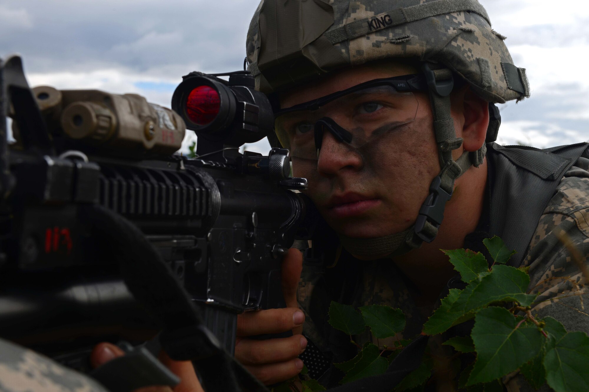 Pfc. Aidan King, a paratrooper assigned to 1st Battalion, 501st Parachute Infantry Regiment, 4th Infantry Brigade Combat Team (Airborne), 25th Infantry Division, U.S. Army Alaska, looks down the scope of his weapon during a joint forcible entry exercise at Malemute Drop Zone on Joint Base Elmendorf-Richardson, Alaska, Aug. 23, 2016, as part of Exercise Spartan Agoge. Spartan Agoge is a brigade-level field training exercise that began Aug. 15, focused on an array of combat-related tasks from squad live-fire exercises to helicopter air insertion and airborne training. (U.S. Air Force Airman 1st Class Javier Alvarez)