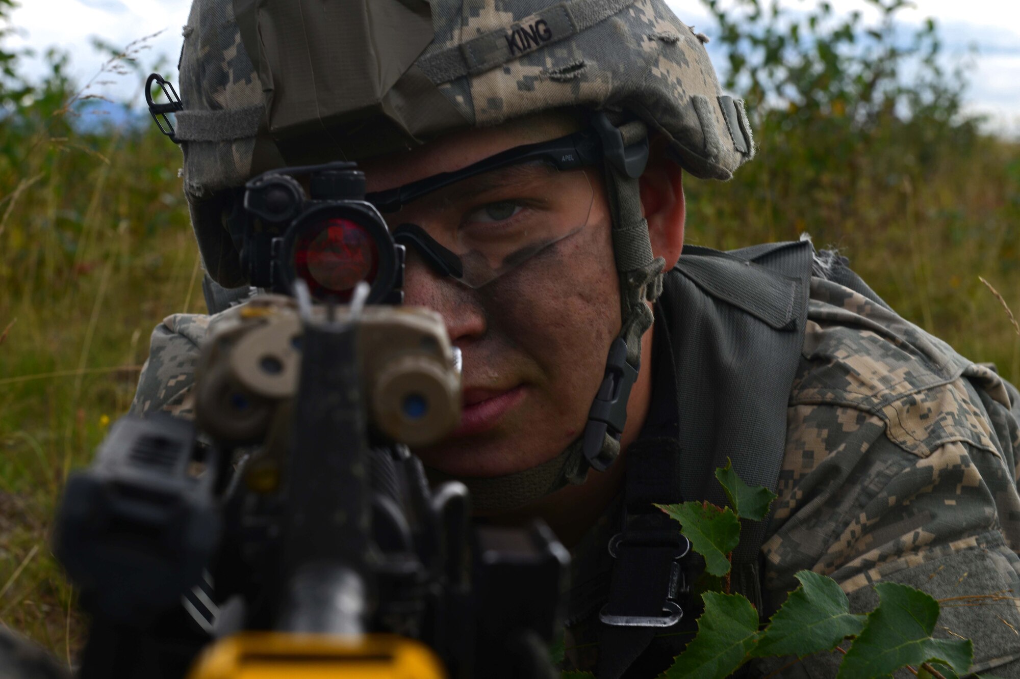 Pfc. Aidan King, a paratrooper assigned to 1st Battalion, 501st Parachute Infantry Regiment, 4th Infantry Brigade Combat Team (Airborne), 25th Infantry Division, U.S. Army Alaska, looks down the scope of his weapon during a joint forcible entry exercise at Malemute Drop Zone on Joint Base Elmendorf-Richardson, Alaska, Aug. 23, 2016, as part of Exercise Spartan Agoge. Spartan Agoge is a brigade-level field training exercise that began Aug. 15, focused on an array of combat-related tasks from squad live-fire exercises to helicopter air insertion and airborne training. (U.S. Air Force Airman 1st Class Javier Alvarez)