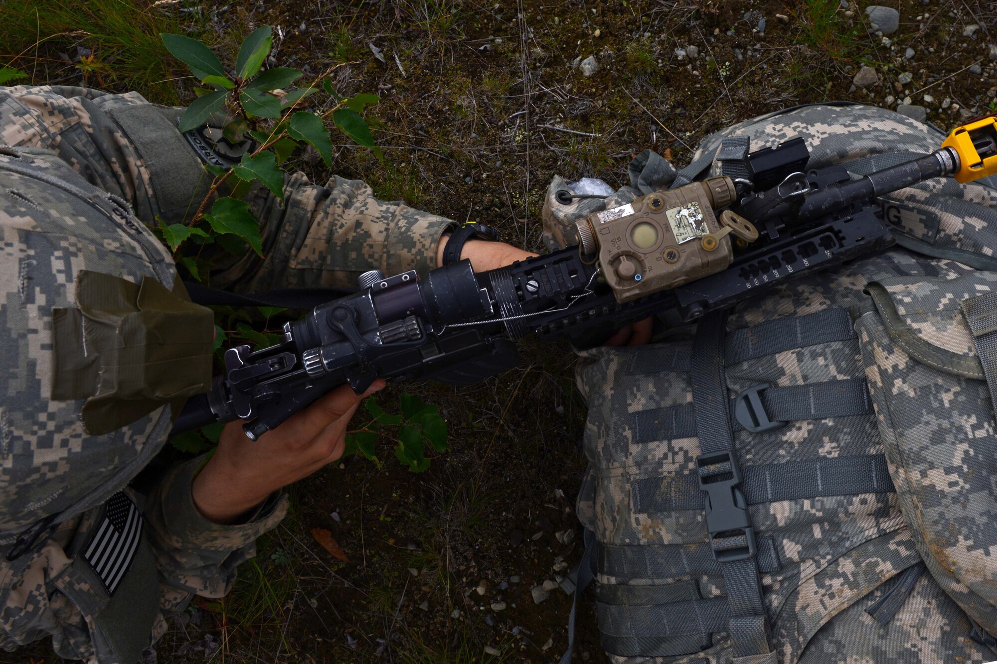 Pfc. Aidan King, a paratrooper assigned to 1st Battalion, 501st Parachute Infantry Regiment, 4th Infantry Brigade Combat Team (Airborne), 25th Infantry Division, U.S. Army Alaska, looks down the scope of his weapon during a joint forcible entry exercise at Malemute Drop Zone on Joint Base Elmendorf-Richardson, Alaska, Aug. 23, 2016, as part of Exercise Spartan Agoge. Spartan Agoge is a brigade-level field training exercise that began Aug. 15, focused on an array of combat-related tasks from squad live-fire exercises to helicopter air insertion and airborne training. (U.S. Air Force Airman 1st Class Javier Alvarez)