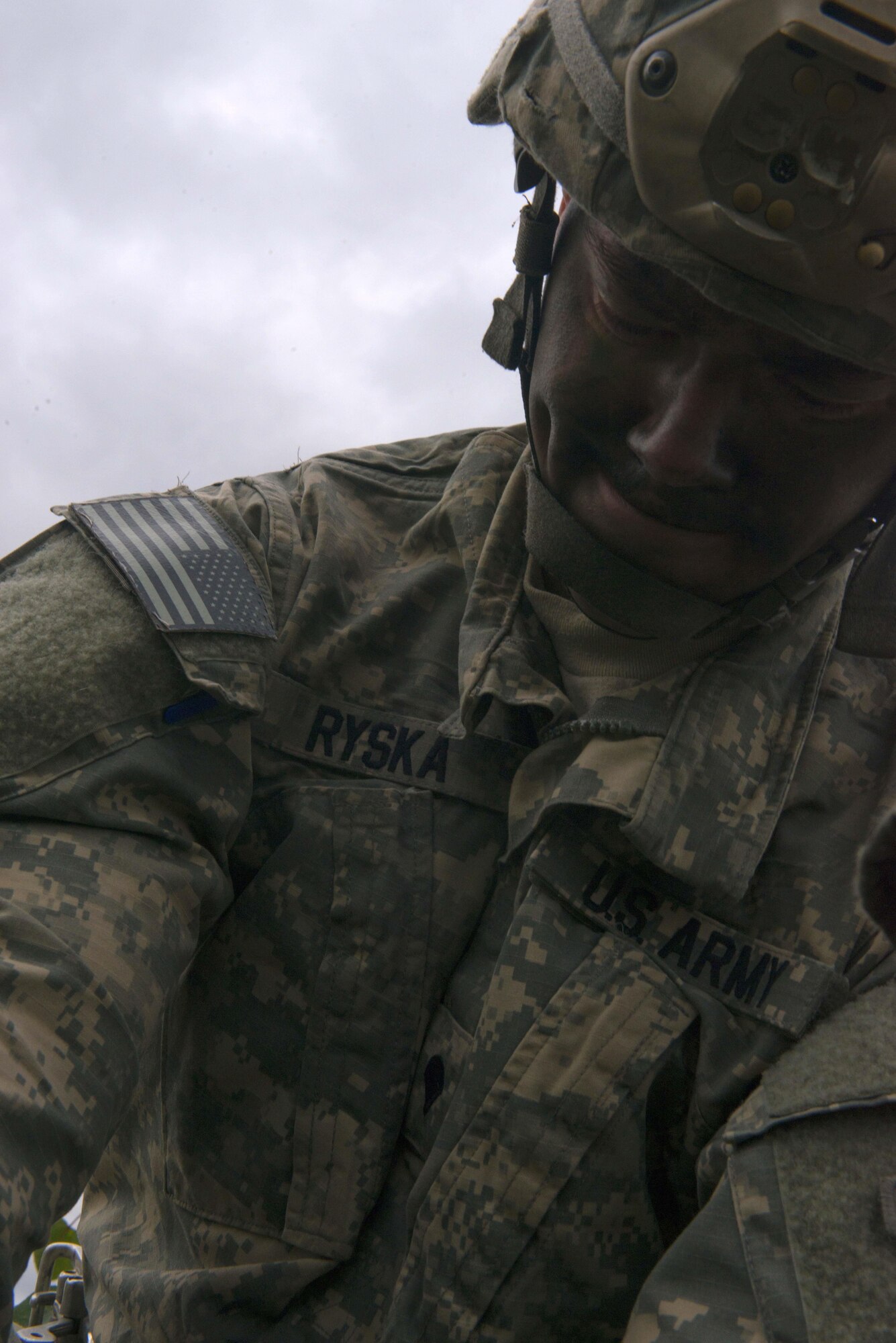 Spc. Nicholas Ryska, a paratrooper assigned to the 4th Infantry Brigade Combat Team (Airborne), 25th Infantry Division, U.S. Army Alaska, gathers his gear during a joint forcible entry exercise at Malemute Drop Zone on Joint Base Elmendorf-Richardson, Alaska, Aug. 23, 2016, as part of Exercise Spartan Agoge. Spartan Agoge is a brigade-level field training exercise that began Aug. 15, focused on an array of combat-related tasks from squad live-fire exercises to helicopter air insertion and airborne training. (U.S. Air Force Airman 1st Class Javier Alvarez)