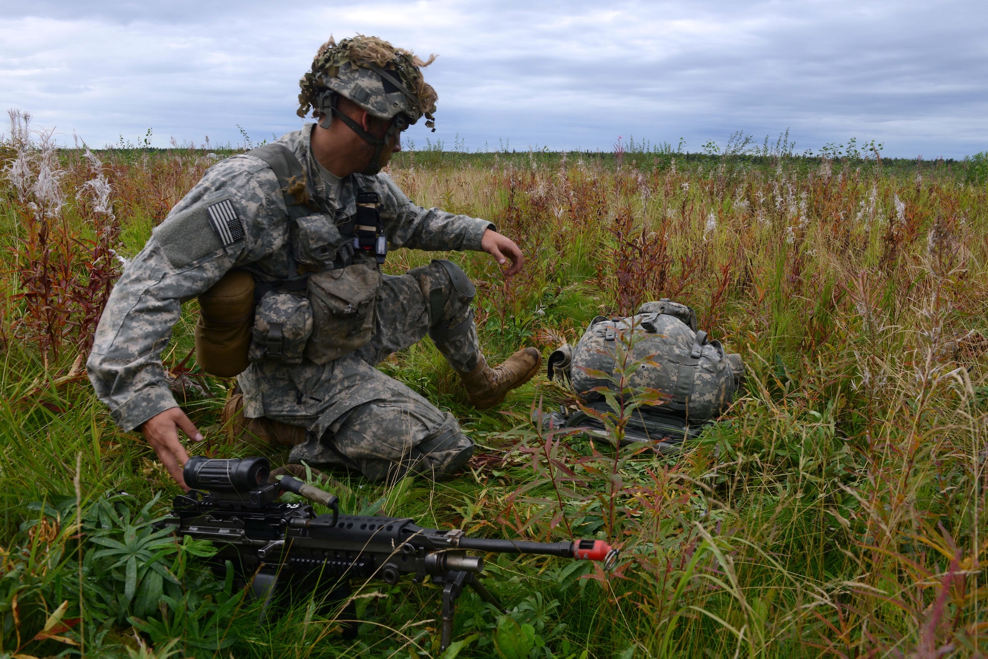 A paratrooper assigned to 1st Battalion, 501st Parachute Infantry Regiment, 4th Infantry Brigade Combat Team (Airborne), 25th Infantry Division, U.S. Army Alaska, places his weapon into operation during a joint forcible entry exercise at Malemute Drop Zone on Joint Base Elmendorf-Richardson, Alaska, Aug. 23, 2016, as part of Exercise Spartan Agoge. Spartan Agoge is a brigade-level field training exercise that began Aug. 15, focused on an array of combat-related tasks from squad live-fire exercises to helicopter air insertion and airborne training. (U.S. Air Force Airman 1st Class Javier Alvarez)