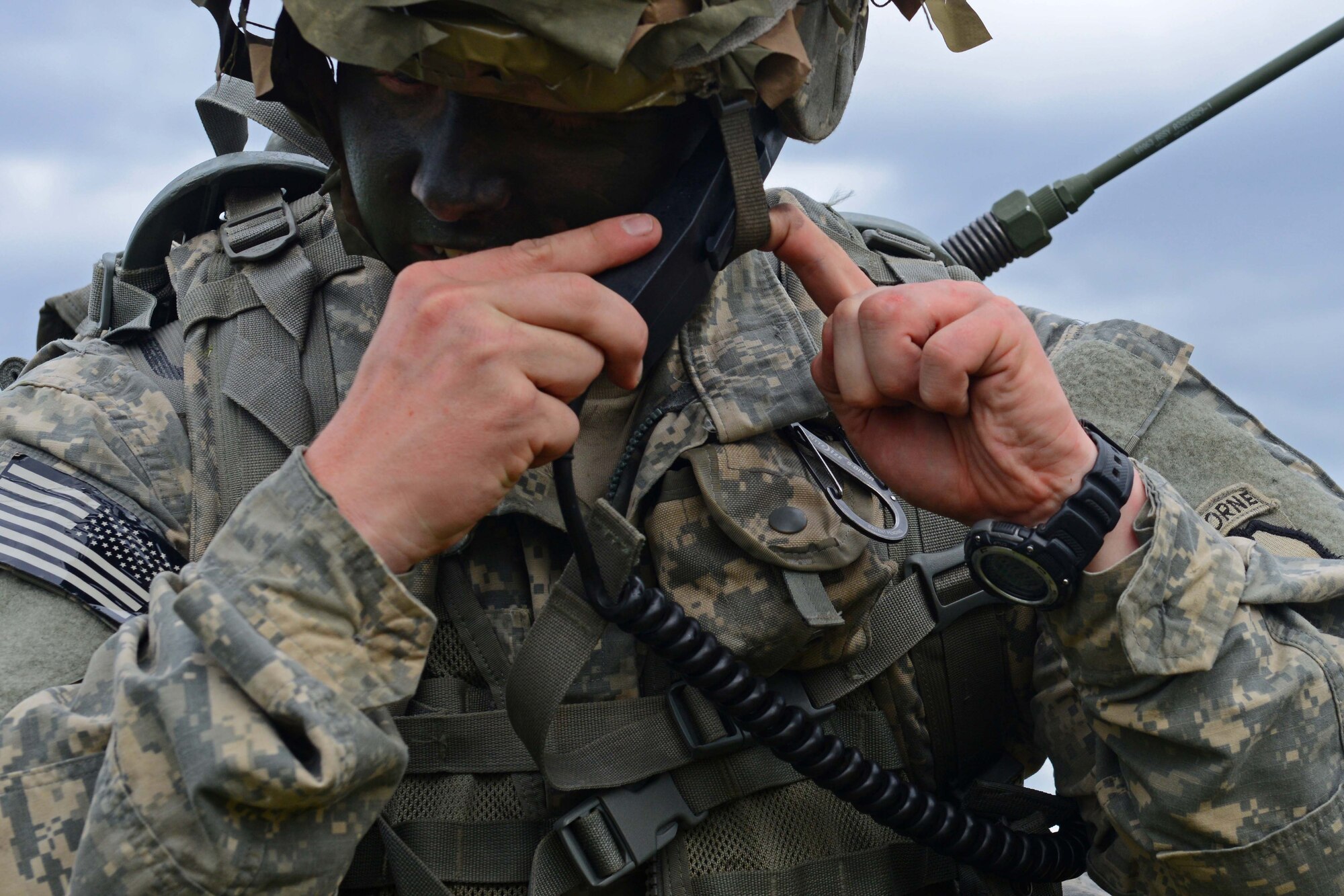 Army 1st Lt. Preston Mozingo, a paratrooper assigned to 1st Battalion, 501st Parachute Infantry Regiment, 4th Infantry Brigade Combat Team (Airborne), 25th Infantry Division, U.S. Army Alaska, readies his headset during a joint forcible entry exercise at Malemute Drop Zone on Joint Base Elmendorf-Richardson, Alaska, Aug. 23, 2016, as part of Exercise Spartan Agoge. Spartan Agoge is a brigade-level field training exercise that began Aug. 15, focused on an array of combat-related tasks from squad live-fire exercises to helicopter air insertion and airborne training. (U.S. Air Force Airman 1st Class Javier Alvarez)