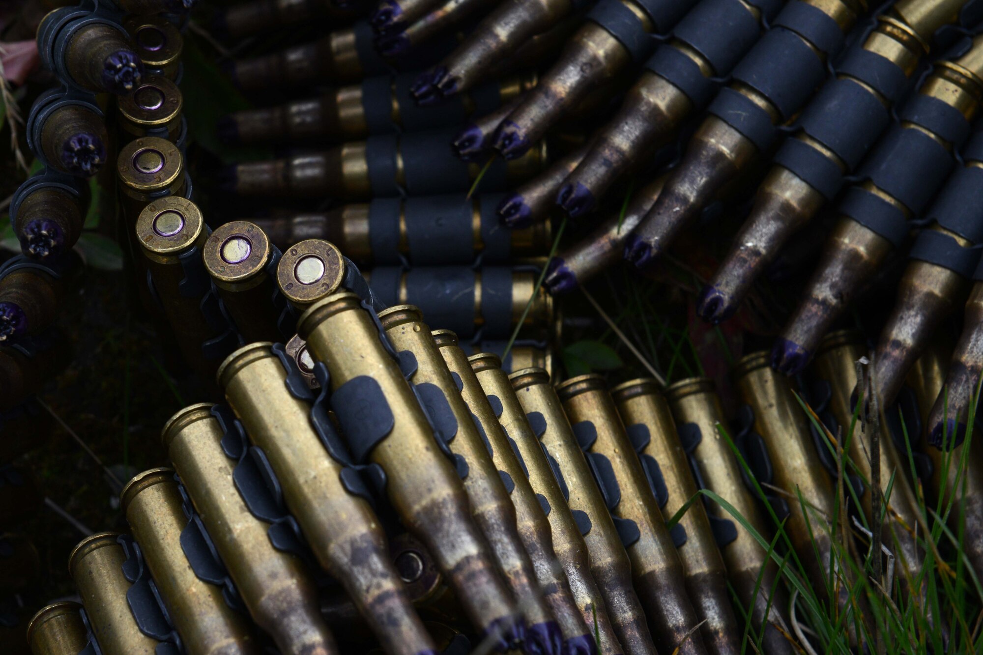 Ammunition for a M240 machine gun sits ready for action following a 4th Infantry Brigade Combat Team (Airborne), 25th Infantry Division, U.S. Army Alaska jump out of C-130 Hercules and C-17 Globemaster III during a joint forcible entry exercise at Malemute Drop Zone on Joint Base Elmendorf-Richardson, Alaska, Aug. 23, 2016, as part of Exercise Spartan Agoge. Spartan Agoge is a brigade-level field training exercise that began Aug. 15, focused on an array of combat-related tasks from squad live-fire exercises to helicopter air insertion and airborne training. (U.S. Air Force Airman 1st Class Javier Alvarez)