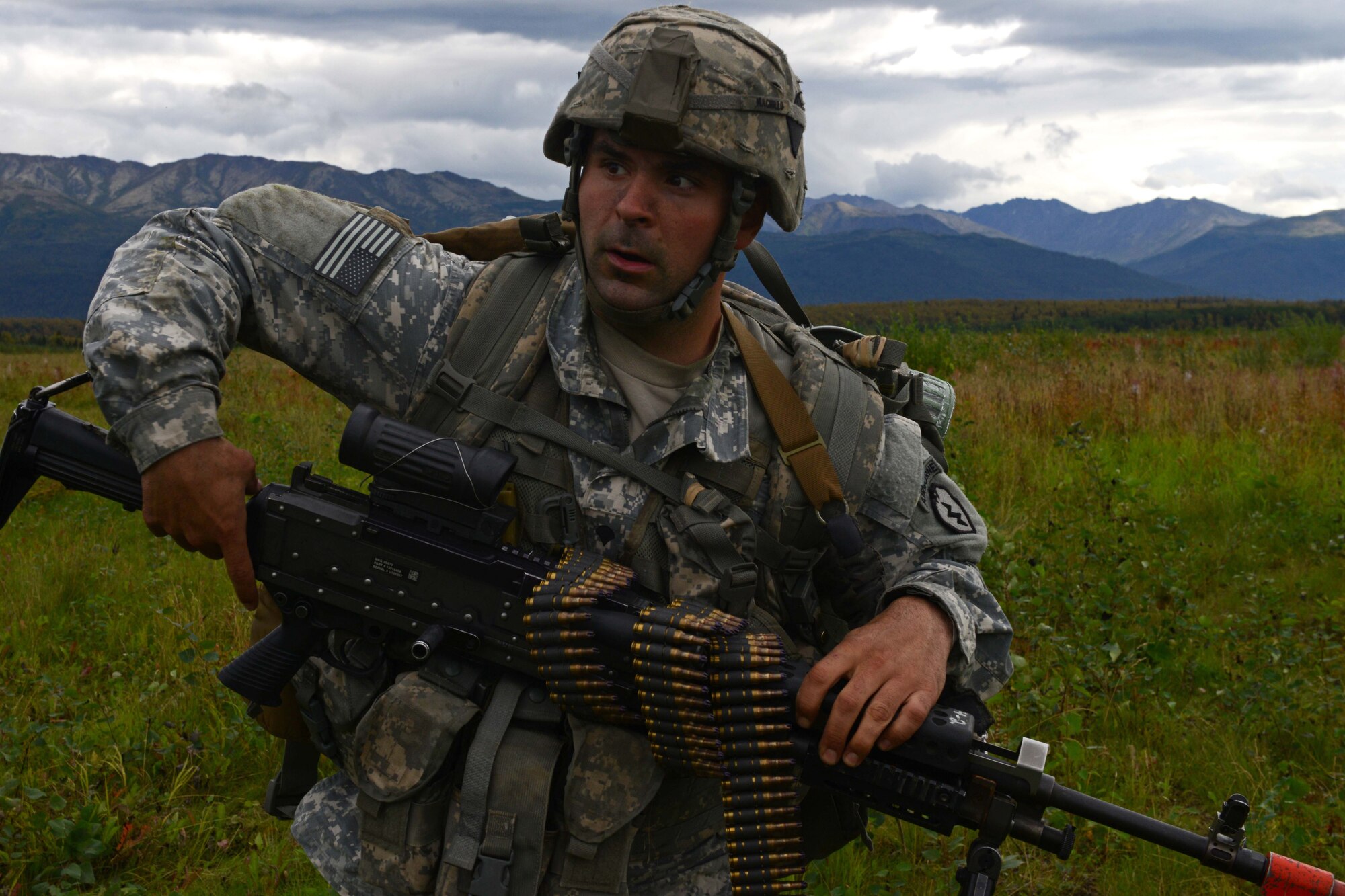 Spc. Christopher Machello, a paratrooper assigned to 1st Battalion, 501st Parachute Infantry Regiment, 4th Infantry Brigade Combat Team (Airborne), 25th Infantry Division, U.S. Army Alaska, inspects the drop-zone during a joint forcible entry exercise at Malemute Drop Zone on Joint Base Elmendorf-Richardson, Alaska, Aug. 23, 2016, as part of Exercise Spartan Agoge. Spartan Agoge is a brigade-level field training exercise that began Aug. 15, focused on an array of combat-related tasks from squad live-fire exercises to helicopter air insertion and airborne training. (U.S. Air Force Airman 1st Class Javier Alvarez)
