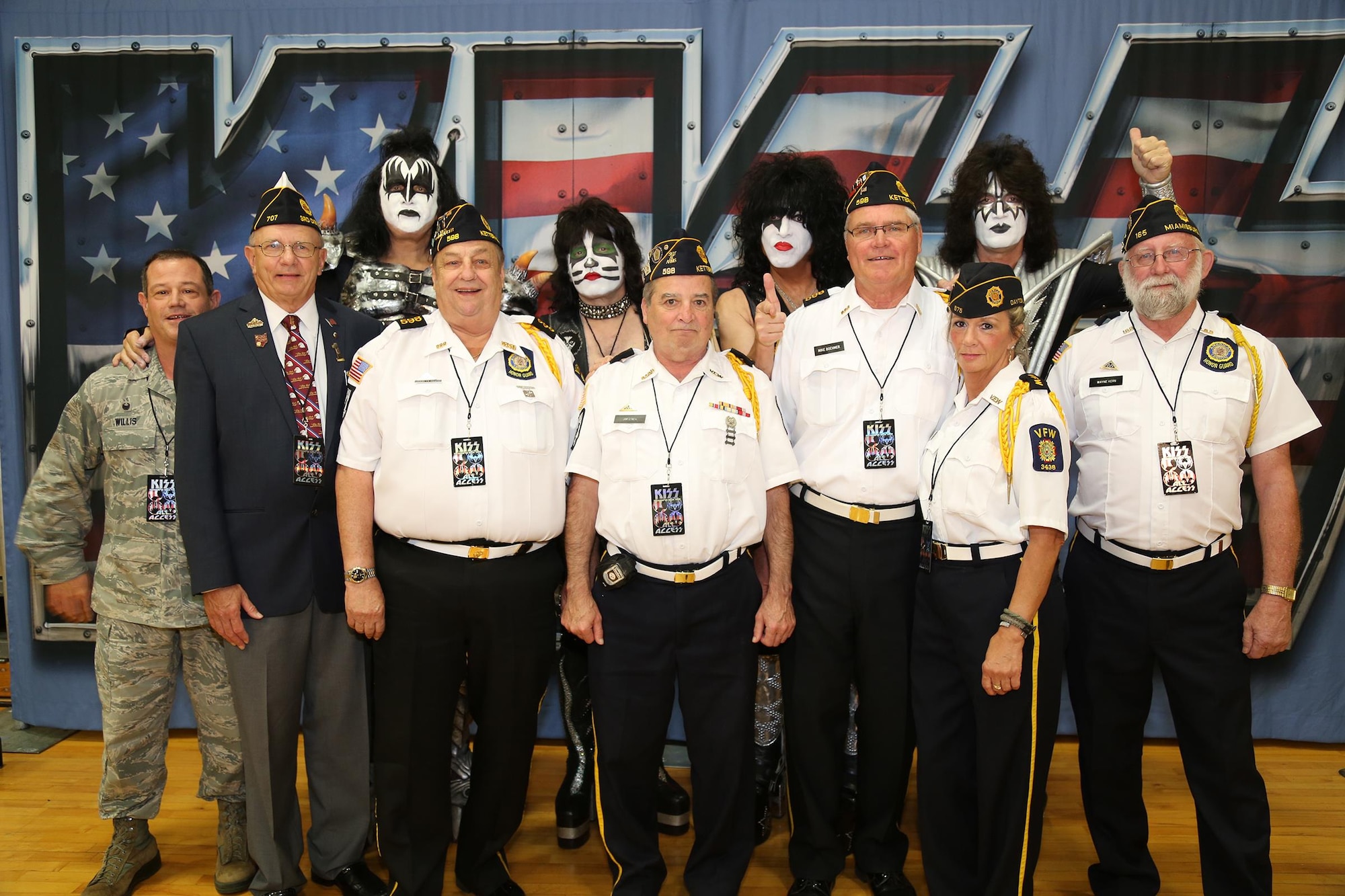 Col. Adam Willis, 445th Airlift Wing commander, along with the Color Guard from the Veterans of Foreign Wars Post 3438, West Carrollton, Ohio, pose with the rock band, KISS, during the band's performance Aug.22, 2016. KISS is currently on a 40-city "Freedom To Rock" tour to honor U.S. veterans across the nation and provides donations to the U.S. Chamber of Commerce Foundation’s Hiring Our Heroes program. (Courtesy photo)