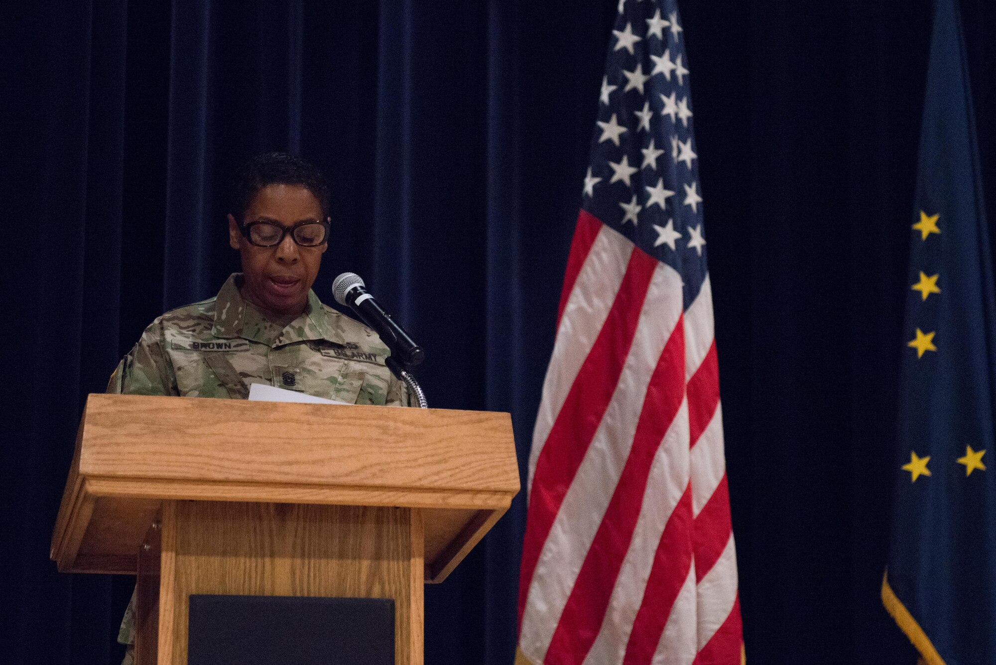 Command Sgt. Maj. Pamela Brown, 17th Combat Support and Sustainment Battalion senior enlisted advisor, speaks at the Women's Equality Day observance at the Frontier Theater, Aug. 24. The observance celebrated 96 years since the passing of the 19th Amendment, which allowed women the right to vote. (U.S. Air Force photo by Senior Airman Kyle Johnson)