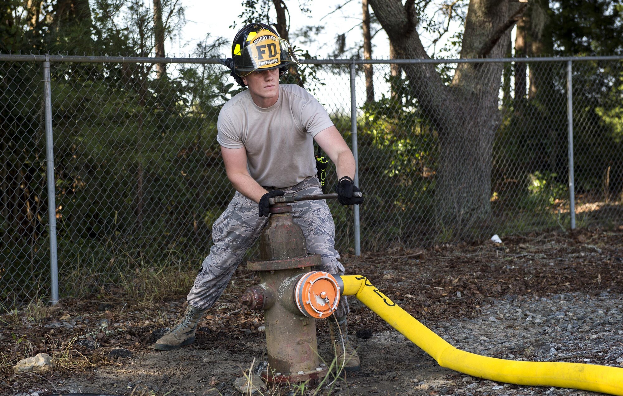 U.S. Air Force Airman Jacob Molden, 23d Civil Engineer Squadron firefighter, closes a fire hydrant during a joint live fire training exercise, Aug. 24, 2016, at Moody Air Force Base, Ga. After the firetrucks deplete their water supply, they’re refilled by the on-site hydrant.  (U.S. Air Force photo by Airman 1st Class Janiqua P. Robinson)