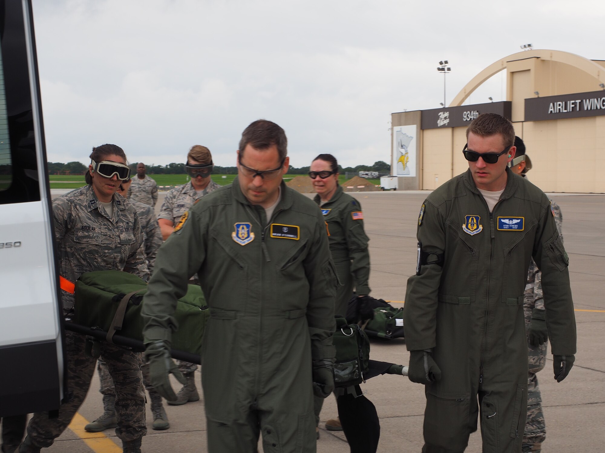 Air Force Reservists load 'patients' on to a C-130 with engines running at Minneapolis-St. Paul Air Reserve Station, Minn.  as part of exercise Patriot Warrior.  The multiservice exercise was designed to test the ability of medical personnel to treat patients in the field and transfer them to larger better equipped facilities during simulated wartime conditions.   