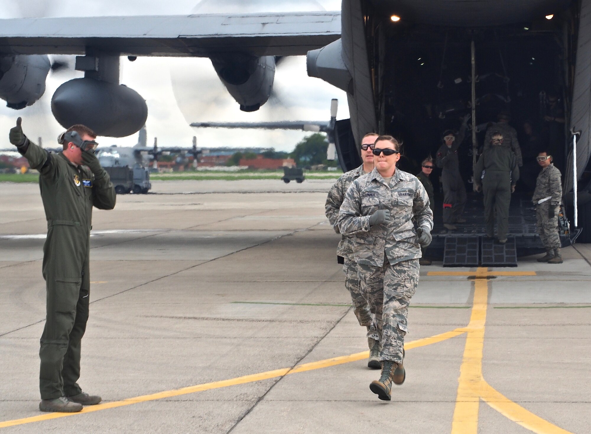 Air Force Reservists load 'patients' on to a C-130 with engines running at Minneapolis-St. Paul Air Reserve Station, Minn.  as part of exercise Patriot Warrior.  The multiservice exercise was designed to test the ability of medical personnel to treat patients in the field and transfer them to larger better equipped facilities during simulated wartime conditions.   