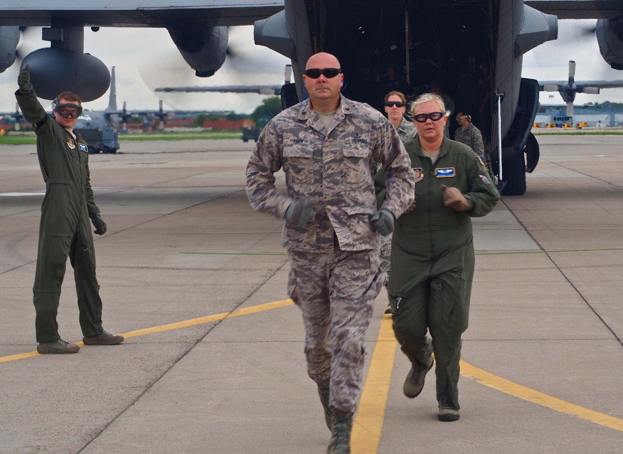 Air Force Reservists load 'patients' on to a C-130 with engines running at Minneapolis-St. Paul Air Reserve Station, Minn.  as part of exercise Patriot Warrior.  The multiservice exercise was designed to test the ability of medical personnel to treat patients in the field and transfer them to larger better equipped facilities during simulated wartime conditions.   