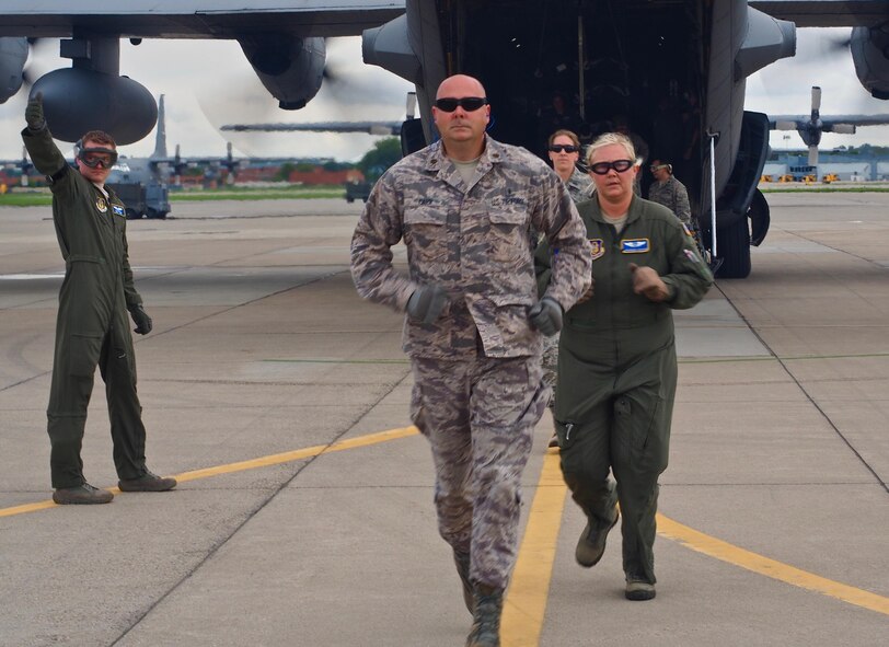 Air Force Reservists load 'patients' on to a C-130 with engines running at Minneapolis-St. Paul Air Reserve Station, Minn.  as part of exercise Patriot Warrior.  The multiservice exercise was designed to test the ability of medical personnel to treat patients in the field and transfer them to larger better equipped facilities during simulated wartime conditions.   