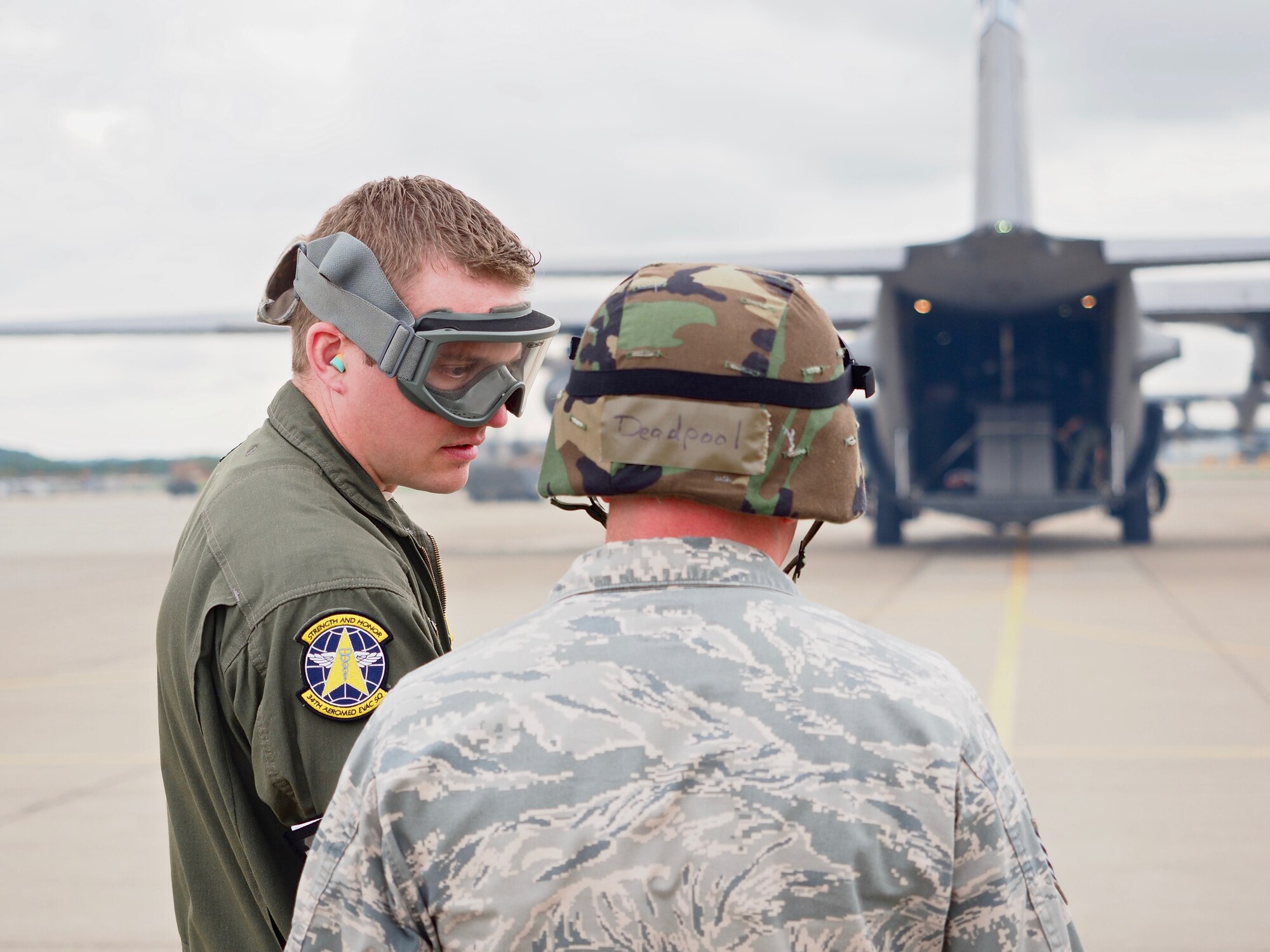 Air Force Reservists load 'patients' on to a C-130 with engines running at Minneapolis-St. Paul Air Reserve Station, Minn.  as part of exercise Patriot Warrior.  The multiservice exercise was designed to test the ability of medical personnel to treat patients in the field and transfer them to larger better equipped facilities during simulated wartime conditions.   