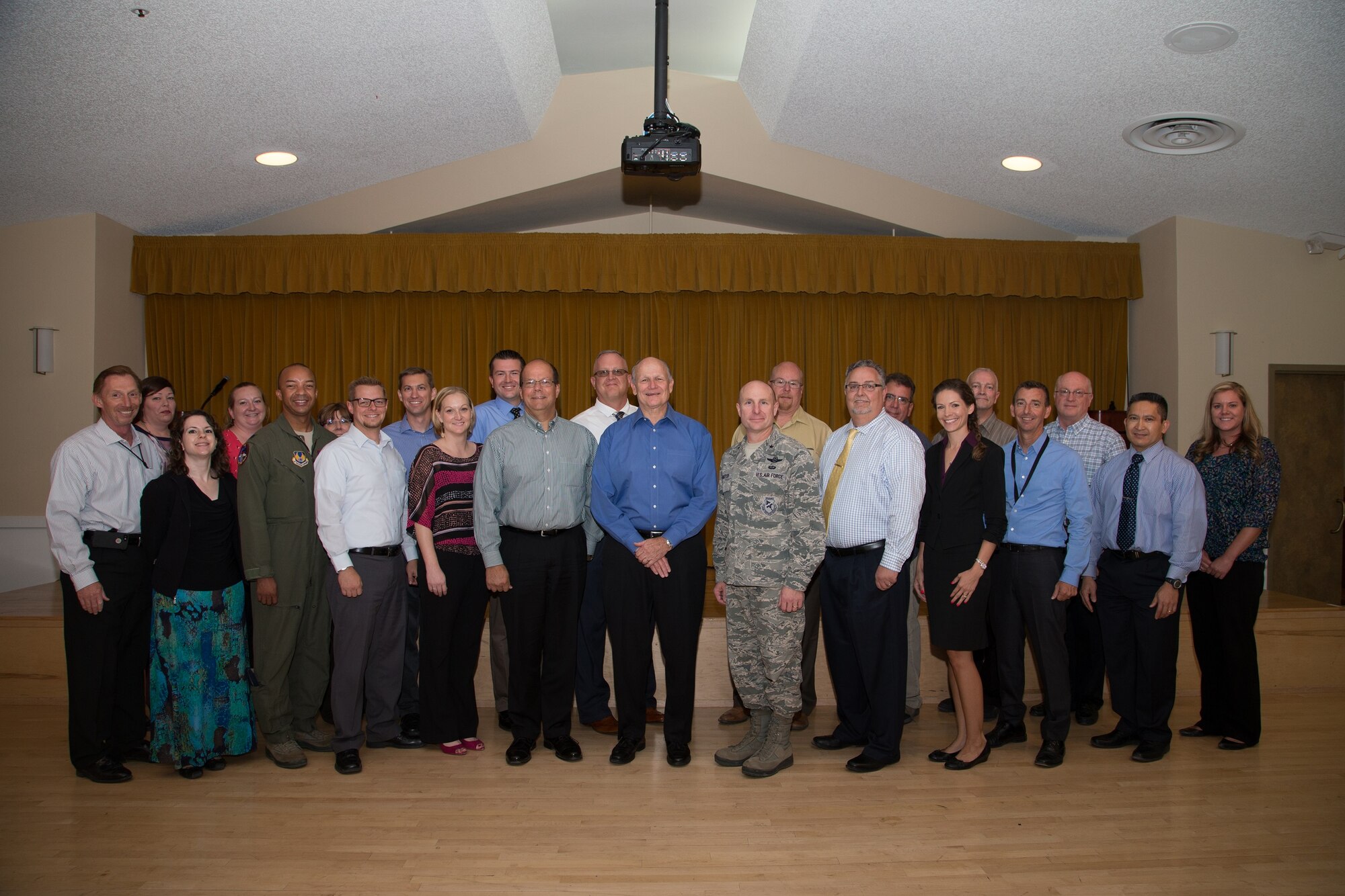 Retired Air Force Gen. Gregory S. Martin (center) poses for a group photo with the 412th Test Wing Innovation Team at Club Muroc Aug. 24. (U.S. Air Force photo by Don Allen)
