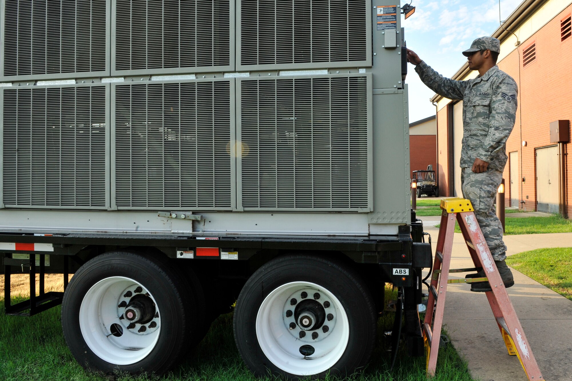 U.S. Air Force Senior Airman Pierre Hill, 19th Civil Engineer Squadron heating, ventilating and air conditioning journeyman, performs an operational check on a portable chiller Aug. 9, 2016, at Little Rock Air Force Base, Ark. Portable chillers are used when a building’s main air and conditioning unit malfunctions. (U.S. Air Force photo by Senior Airman Stephanie Serrano)