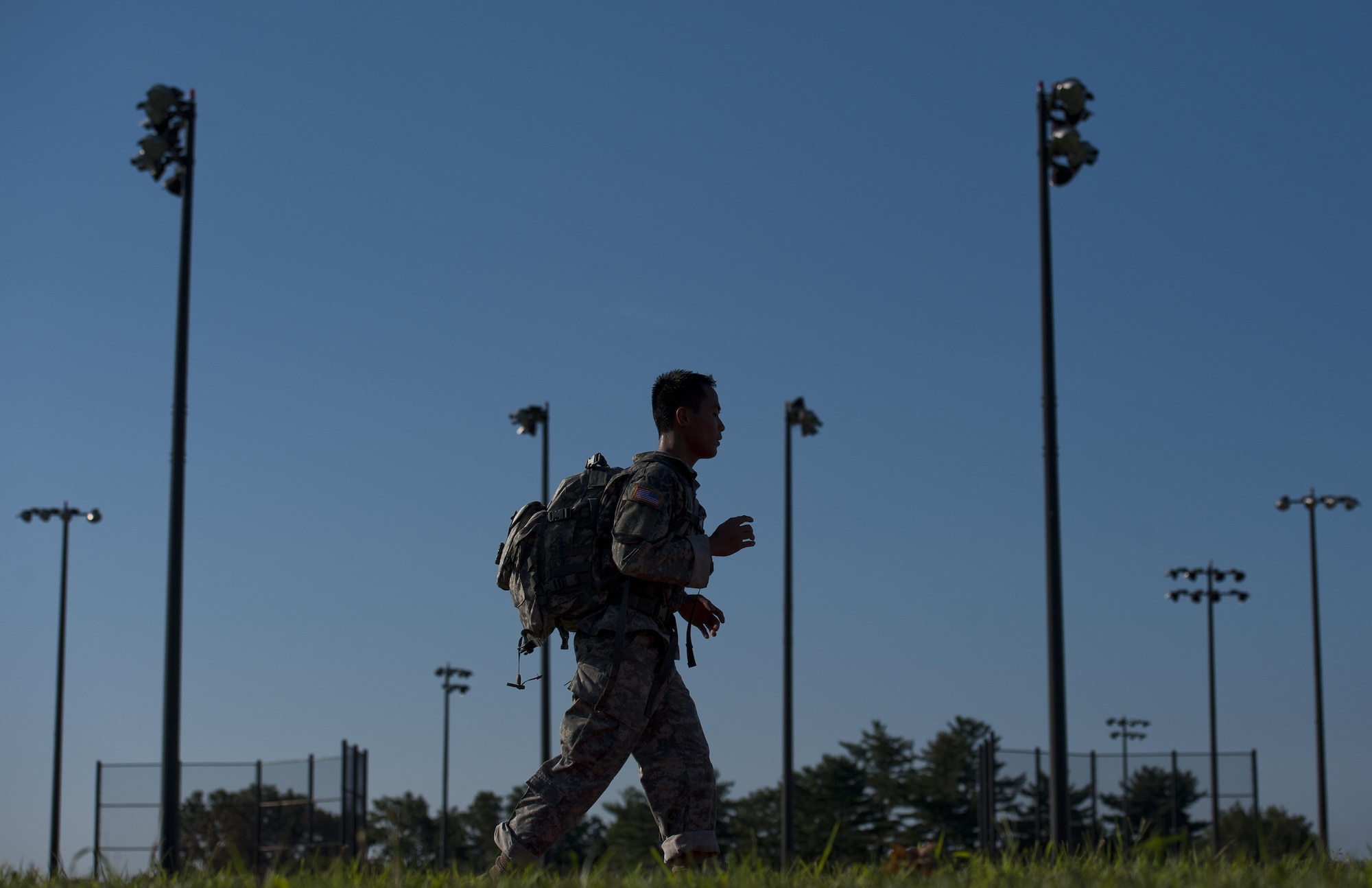 Spc. Nambaraney Dy, 147th Medical Detachment Veterinary Services, competes in the road march portion of the GAFPB competition, Aug 21. (U.S. Air Force photo by Christian DeLuca/released)