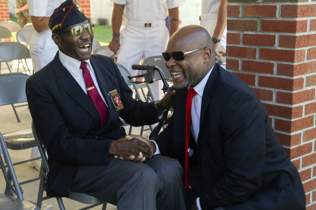 Montford Point Marines and their families gathered during the Montford Point Day Ceremony at Camp Johnson on Marine Corps Base Camp Lejeune, Aug. 25. During the ceremony, three family members were presented a certificate of recognition and a Congressional Gold Medal on behalf of their relatives who were members of the original Montford Point Marines. (U.S. Marine Corps photo by Cpl. Mark Watola /Released)