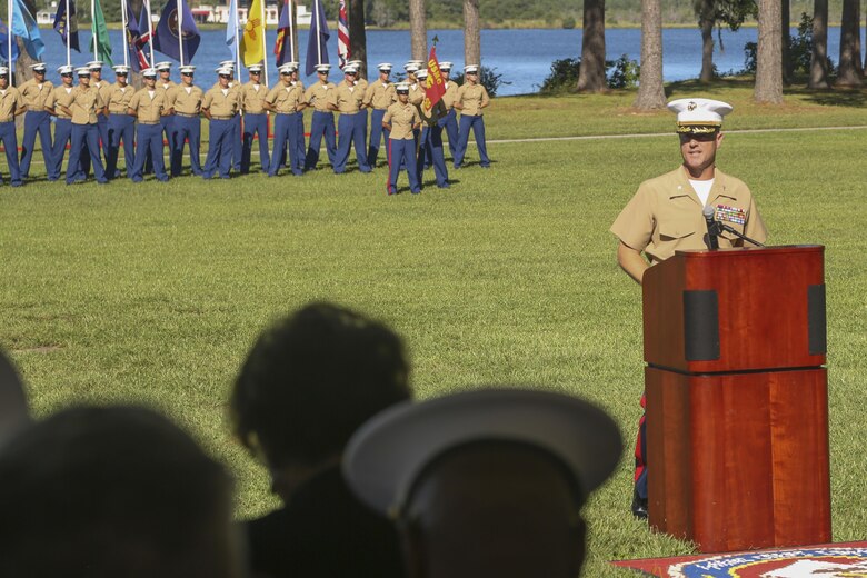 Col. David P. Grant, Marine Corps Combat Service Support Schools commanding officer, speaks during the Montford Point Day Ceremony at Camp Johnson on Marine Corps Base Camp Lejeune, Aug. 25. During the ceremony, three family members were presented a certificate of recognition and a Congressional Gold Medal on behalf of their relatives who were members of the original Montford Point Marines. (U.S. Marine Corps photo by Cpl. Mark Watola /Released)