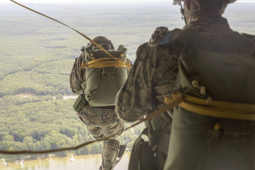 Marines jump from the back of a C-130 during Exercise Northern Strike 2016 at Camp Grayling Joint Maneuver Training Center, Mich., Aug. 17, 2016. The exercise unites about 5,000 service members from 20 states and three coalition countries to provide accessible, readiness-building opportunities for military units from all service branches. Marine Corps photo by Lance Cpl. Devan Barnett