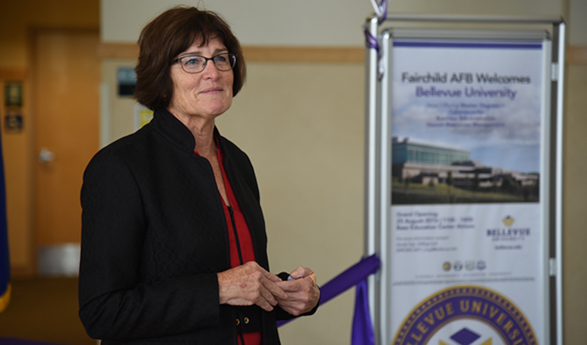 Dr. Mary Hawkins, Bellevue University president, reflects about her time as a military spouse during the ribbon-cutting ceremony for Bellevue University Aug. 25, 2016, at Fairchild Air Force Base. Since Hawkins joined the institution in 1995, Bellevue University enrollment has experienced record growth and has been consistently ranked as one of the nation’s best online learning and military-friendly institutions. (U.S. Air Force photo/Airman 1st Class Mackenzie Richardson)