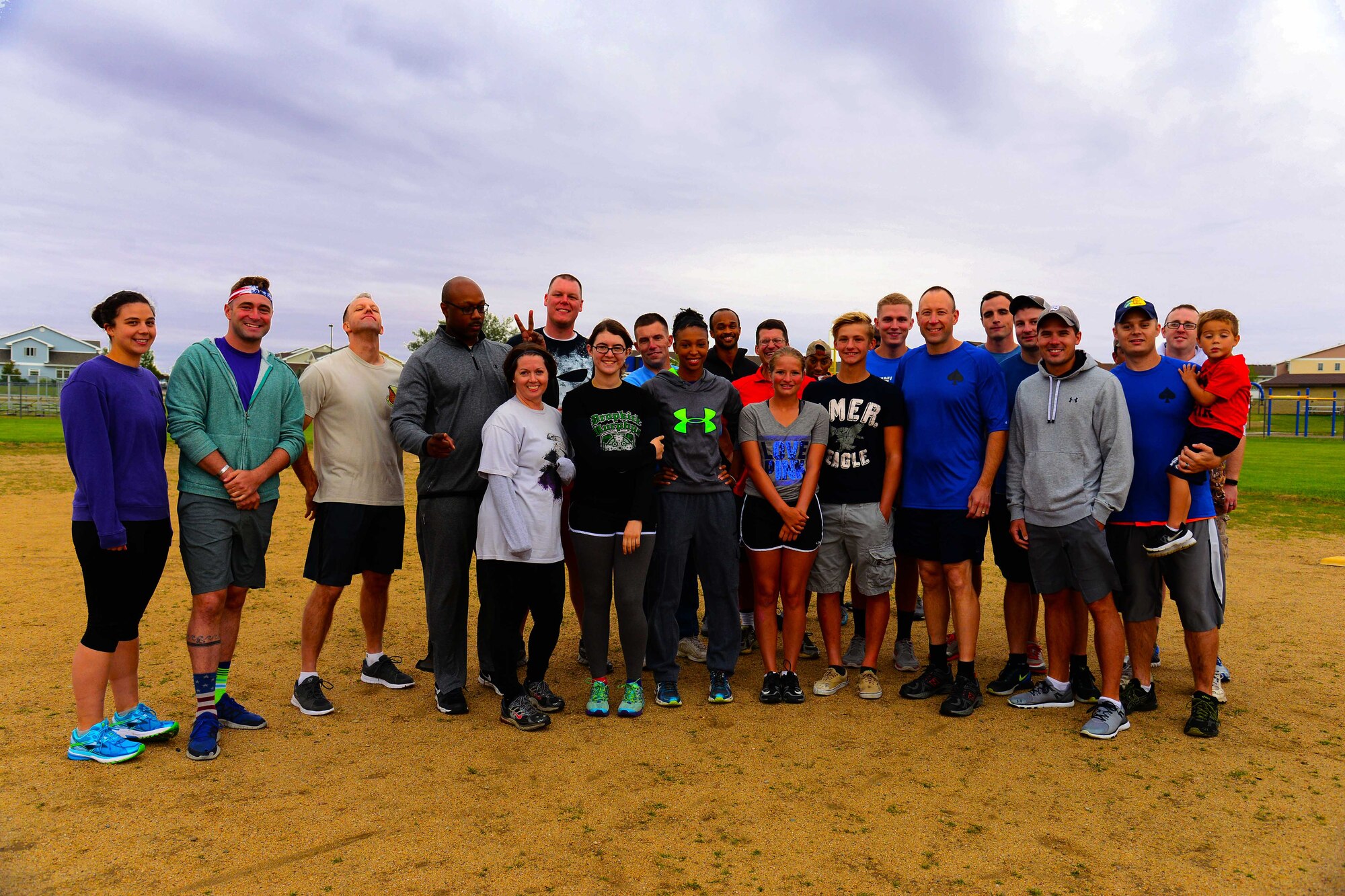 Airmen assigned to the 341st Missile Wing and family members pose for a photo Aug. 18, 2016, at Malmstrom Air Force Base, Mont. These individuals played the second game of the Adult Beverage Kickball League, an unofficial base-wide sport played by several squadrons on base. (U.S. Air Force photo/Airman 1st Class Magen M. Reeves)
