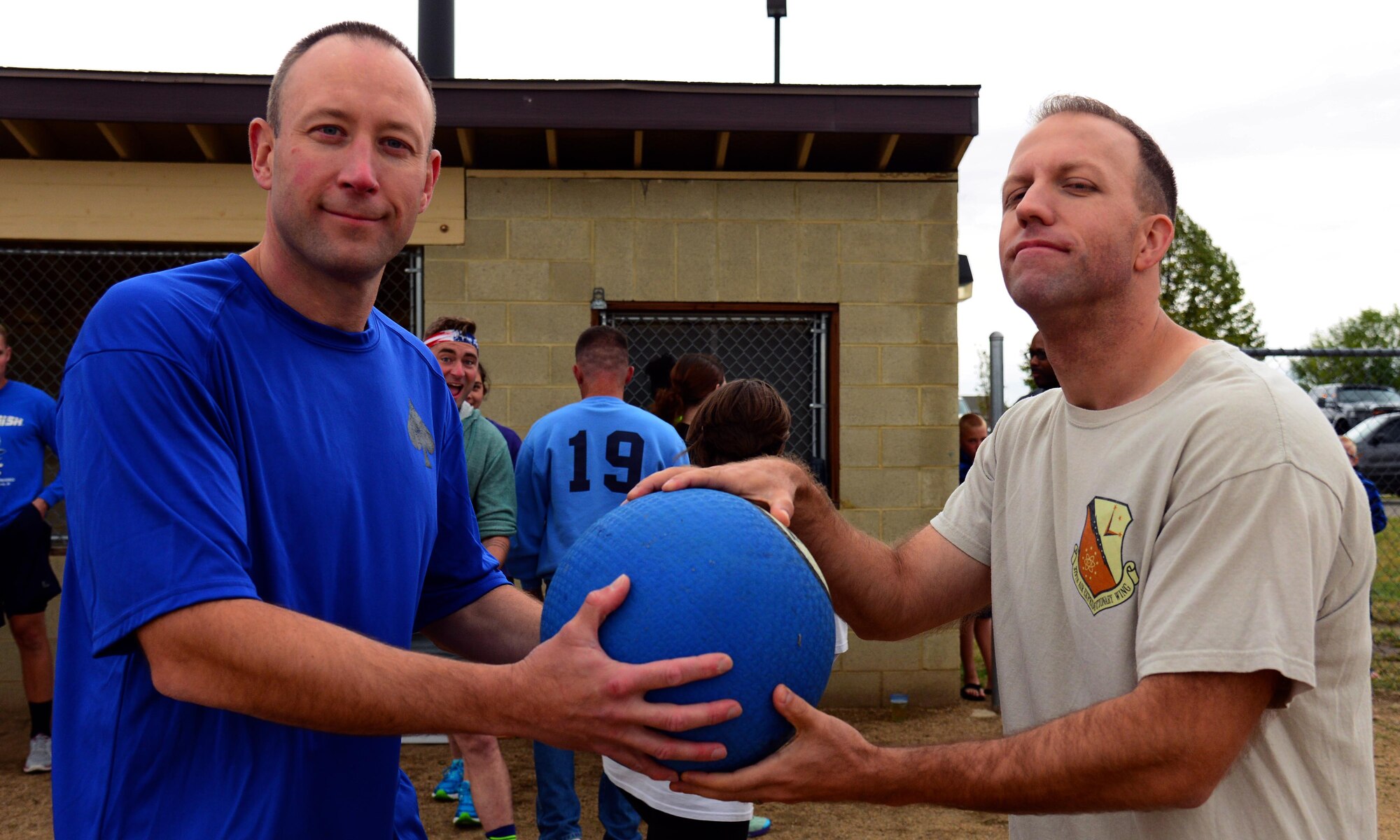 Lt. Col. Mark Kasayka, 10th Missile Squadron commander, left, and Maj. Michael Giacomazzi, 341st Comptroller Squadron commander, right, face-off during a kickball game Aug. 18, 2016, at Malmstrom Air Force Base, Mont. The squadron commanders acted as team captains during the second game of the Adult Beverage Kickball League. (U.S. Air Force photo/Airman 1st Class Magen M. Reeves)