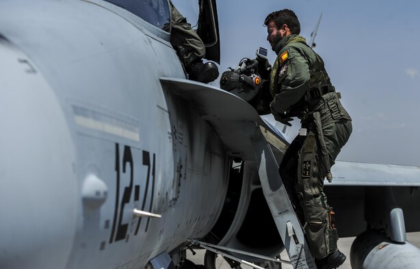 A Spanish Air Force pilot climbs a ladder to get in an EF-18M during Red Flag 16-4 at Nellis Air Force Base, Aug. 17, 2016. The joint, full-spectrum exercise provided the most realistic combat training available. (U.S. Air Force photo/Airman 1st Class Kevin Tanenbaum)