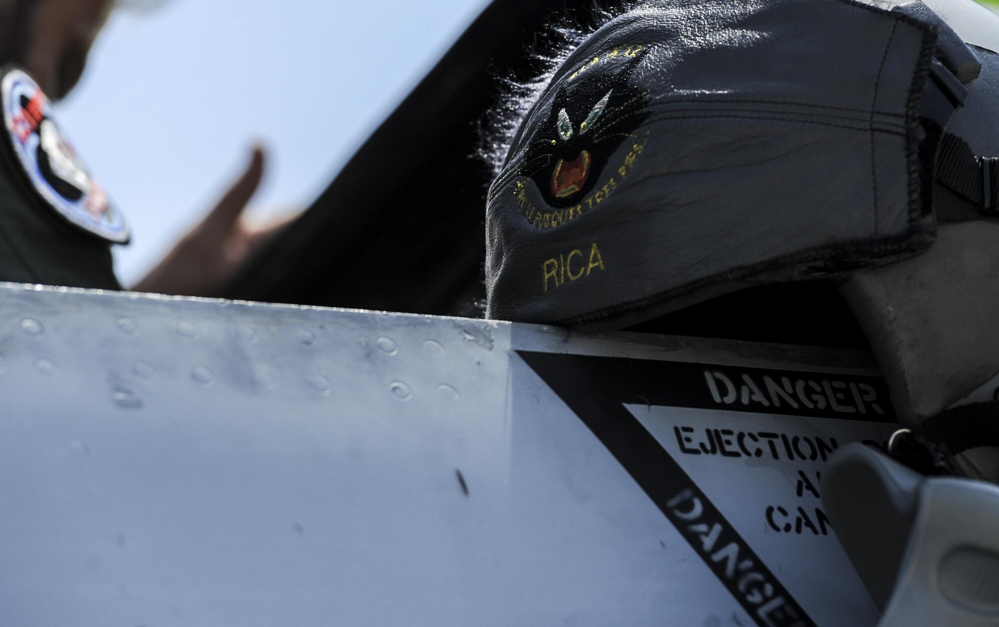 The helmet of a Spanish air force pilot sits on the side of the cockpit during preflight checks at Nellis Air Force Base, Nev., before participating in Red Flag 16-4, Aug. 17, 2016. Red Flag involves a variety of attack, fighter, bomber, reconnaissance, electronic warfare, air lift support and search and rescue aircraft. (U.S. Air Force photo by Airman 1st Class Kevin Tanenbaum/Released)