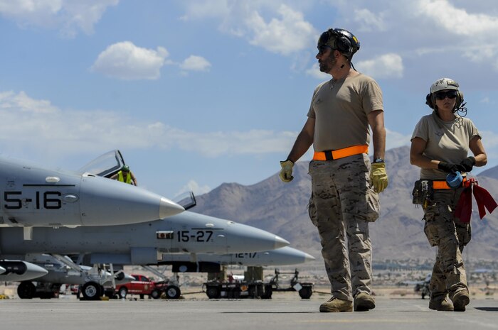 Spanish air force maintainers prepare EF-18Ms for take-off before participating in Red Flag 16-4 at Nellis Air Force Base, Nev., Aug. 17, 2016. Red Flag is a realistic combat training exercise that involves the air, space and cyber forces of the U.S. and its allies, and is conducted on the vast bombing and gunnery ranges on the Nevada Test and Training Range. (U.S. Air Force photo by Airman 1st Class Kevin Tanenbaum/Released)