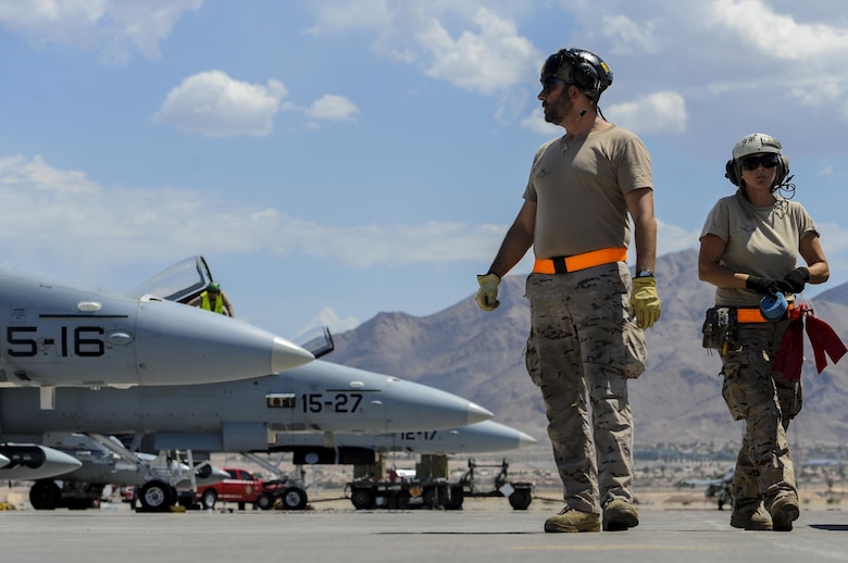Spanish air force maintainers prepare EF-18Ms for take-off before participating in Red Flag 16-4 at Nellis Air Force Base, Nev., Aug. 17, 2016. Red Flag is a realistic combat training exercise that involves the air, space and cyber forces of the U.S. and its allies, and is conducted on the vast bombing and gunnery ranges on the Nevada Test and Training Range. (U.S. Air Force photo by Airman 1st Class Kevin Tanenbaum/Released)