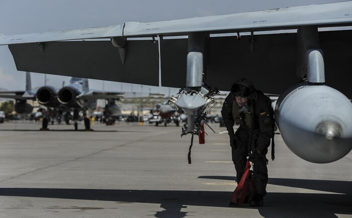 A Spanish air force pilot performs preflight checks on the runway at Nellis Air Force Base, Nev., before flying in Red Flag 16-4, Aug. 17, 2016. The integration of coalition partners from around the world is an important factor in a Red Flag exercise, as it offers a realistic battlespace in which U.S. and allied warfighters work together towards a set of common objectives. (U.S. Air Force photo by Airman 1st Class Kevin Tanenbaum/Released)