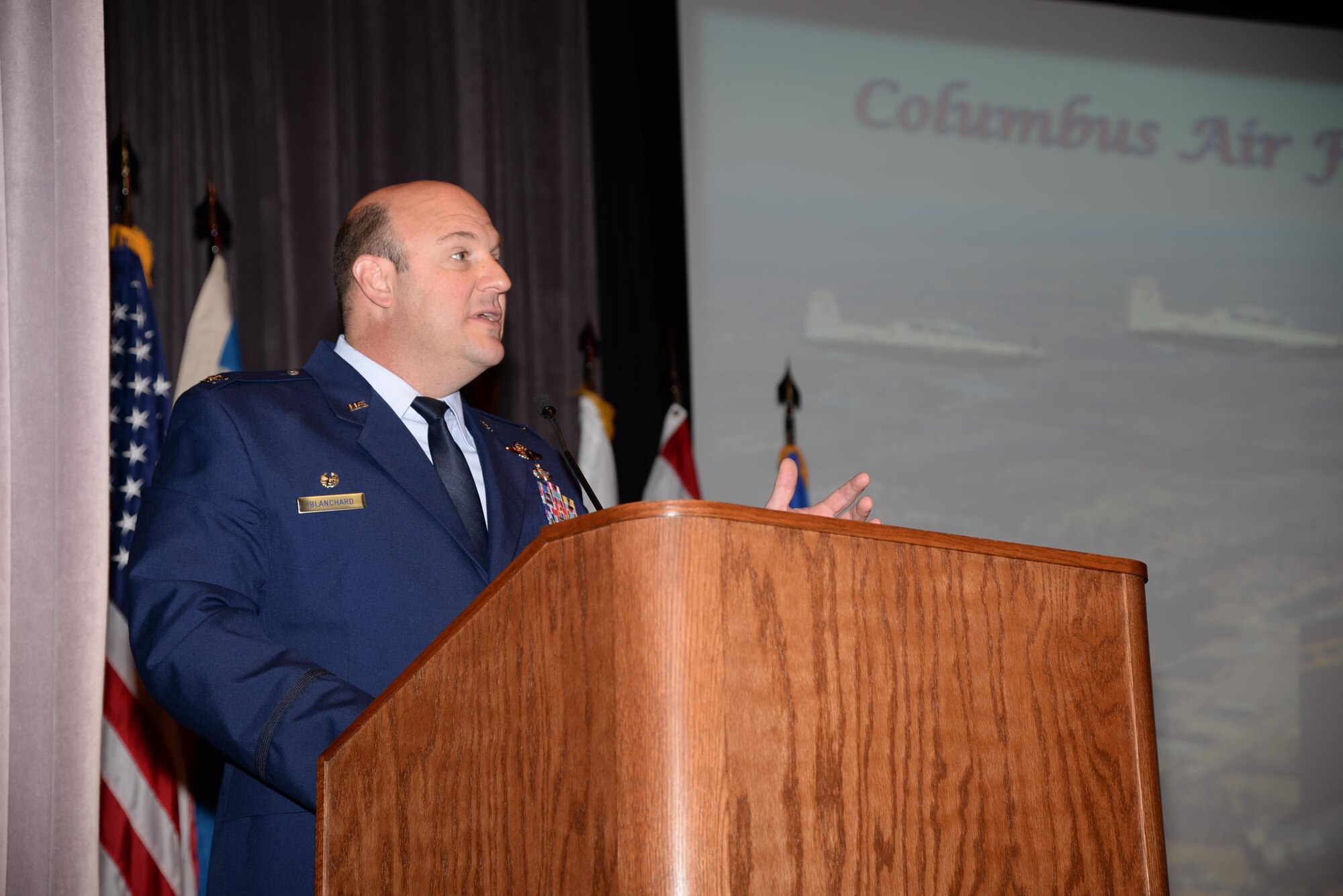 Col. Barry Blanchard, Commander, 172nd Airlift Wing, Thompson Field, Jackson, Mississippi speaks at Columbus Air Force Base, Mississippi, as the guest speaker for Specialized Undergraduate Pilot Training Class 16-13’s graduation Aug. 19. Blanchard spoke about three things he thought were most important for graduates to take away from his experience. (U.S. Air Force photo/Airman 1st Class John Day)