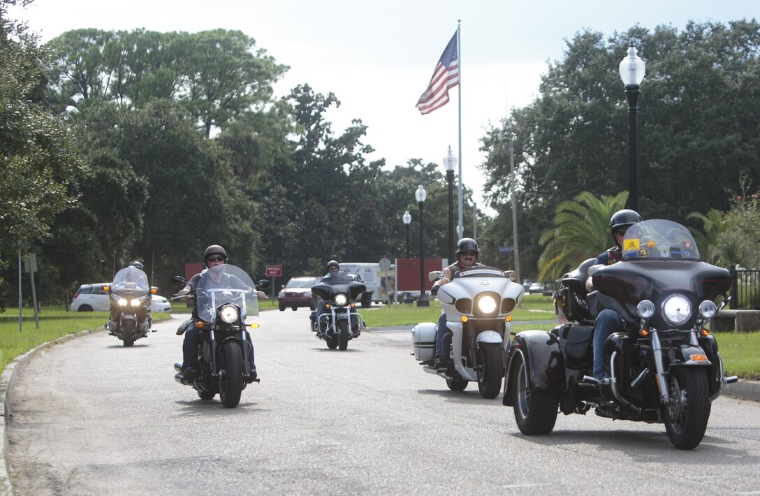 Members of various military and first-responder veteran motorcycle clubs escort a scaled-down replica of the Vietnam Memorial in Washington to Goldring/Woldenberg Great Lawn at City Park, New Orleans, Aug. 24, 2016. The Marine Corps brought the wall to New Orleans as part of a commemorative plan to honor and remember the 50th anniversary of the Vietnam War. The wall arrived in conjunction with Marine Forces Reserve’s Centennial celebration, which began this week with events in New Orleans. (U.S. Marine Corps photo by Sgt. Ian Leones/Released)