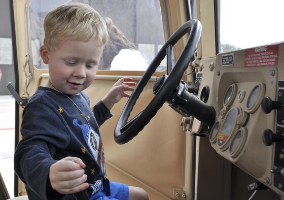 Paxton, 2, gets familiarization training on the Humvee tactical vehicle during the annual Herc Adventure Tour at Peterson Air Force Base, Colo., Aug. 6, 2016. The Herc Adventure Tour provides Air Force Reservists and their families the opportunity to tour the 302nd Airlift Wing's  assigned aircraft as well as experience the equipment operated by several other organizations within the wing. Paxton's father is 2nd Lt. Stephen Collier, a public affairs officer for the wing. (U.S. Air Force photo)

