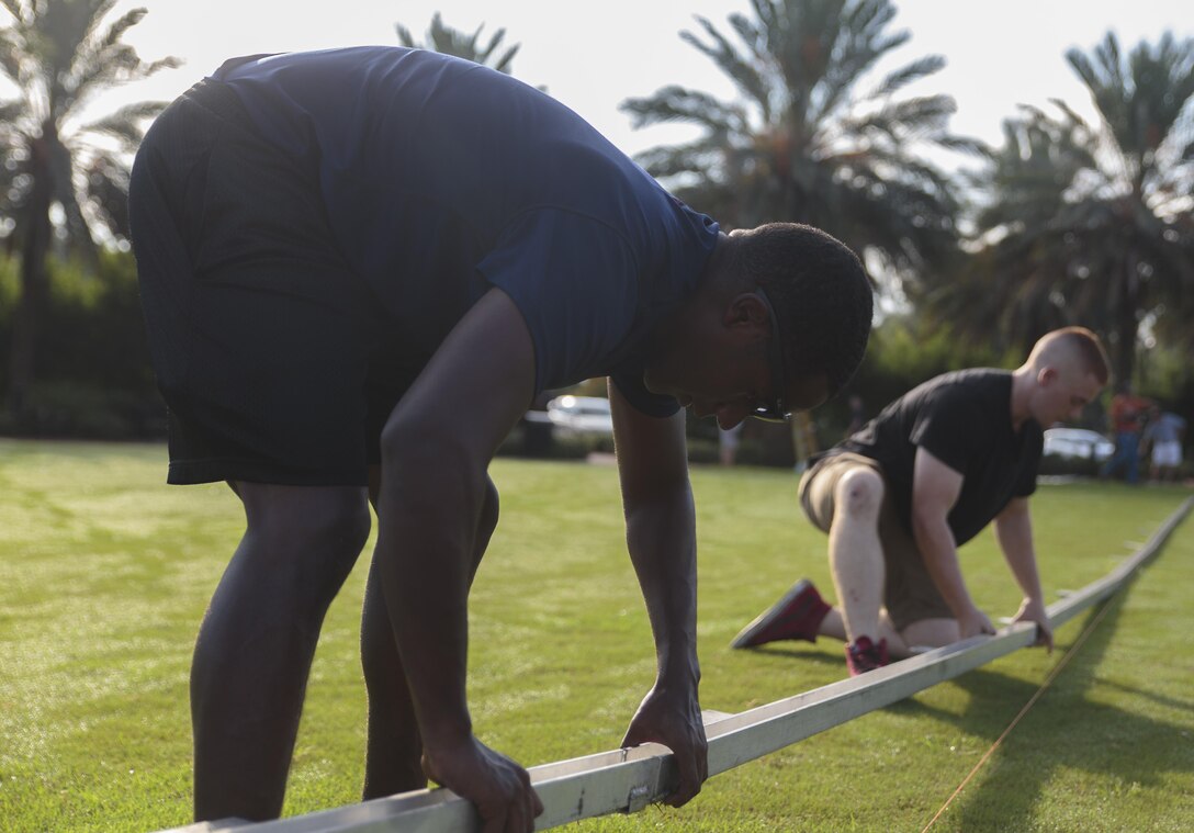 Rhinell A. Barice and Duncan A Stewart, poolees with Marine Corps Recruiting Substation New Orleans, help assemble an 80-percent scale replica of the Vietnam Memorial Wall at the Goldring/Woldenberg Great Lawn in City Park, New Orleans, Aug. 25, 2016. The Marine Corps brought the wall to New Orleans as part of a commemorative plan to honor and remember the 50th anniversary of the Vietnam War. The wall arrived in conjunction with Marine Forces Reserve’s Centennial celebration, which began with events in New Orleans this week. (U.S. Marine Corps photo by Sgt. Ian Leones/Released)