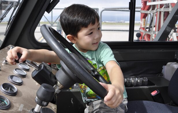 Liam Mounty tries his hand out on "operating" an 40K-loader from the 302nd Logistics Readiness Squadron during the annual Herc Adventure Tour at Peterson Air Force Base, Colo., Aug. 6, 2016. The Herc Adventure Tour provides Air Force Reservists and their families the opportunity to tour the 302nd Airlift Wing's assigned aircraft as well as experience the equipment operated by several other organizations within the wing. Liam's father is Staff Sgt. Wanytha Mounty, a squadron aviation resource management specialist assigned to the 731st Airlift Squadron. (U.S. Air Force photo/2nd Lt. Stephen J. Collier)