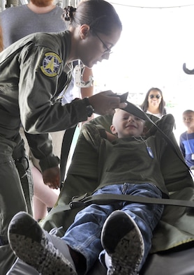 Aeromedical technicians with the 34th Aeromedical Evacuation Squadron give Rowdy an up-close look at what evacuated individuals feel when they are transported on C-130 Hercules aircraft during the annual Herc Adventure Tour at Peterson Air Force Base, Colo., Aug. 6, 2016. The Herc Adventure Tour provides Air Force Reservists and their families the opportunity to tour the 302nd Airlift Wing's assigned aircraft as well as experience the equipment operated by several other organizations within the wing. (U.S. Air Force photo/2nd Lt. Stephen J. Collier)