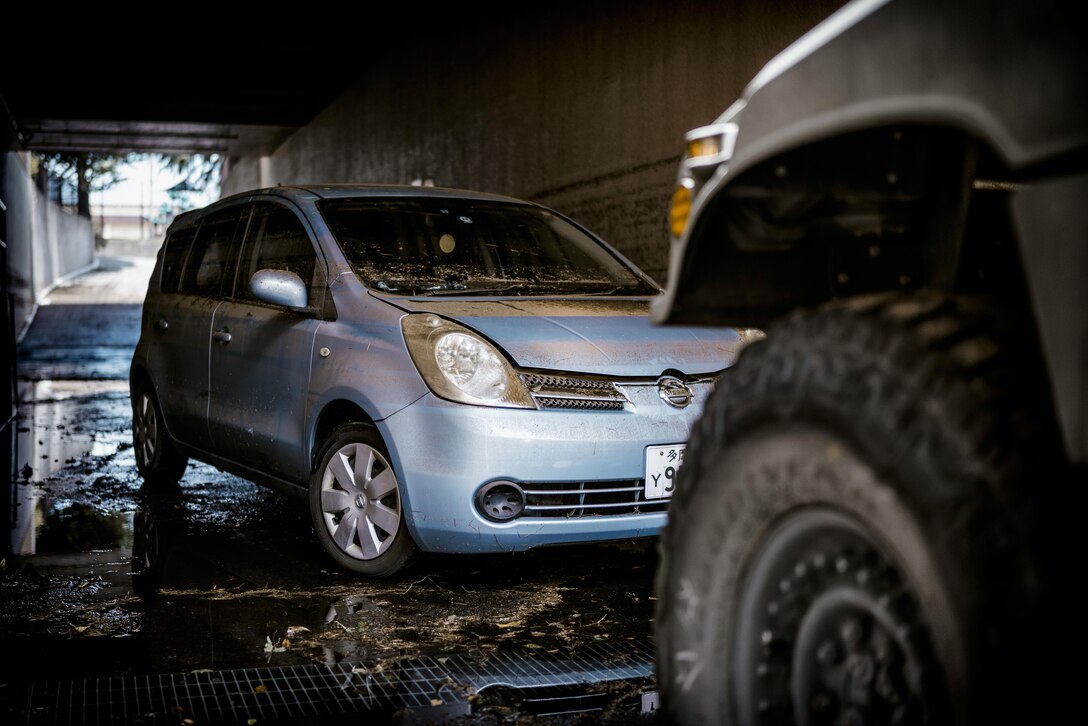 A vehicle damaged by a typhoon prepares to be towed at Yokota Air Base, Japan, Aug. 23, 2016. Tropical Storm Mindulle struck Yokota Aug. 22, causing flooding, power outages and physical damage. More than 300 families were relocated to housing with bedding, power and hot water in the wake of the storm. The 374 CES, other emergency response units on base and community volunteers assisted, and continue to assist, with the recovery. (U.S. Air Force photo by Senior Airman Delano Scott/Released)