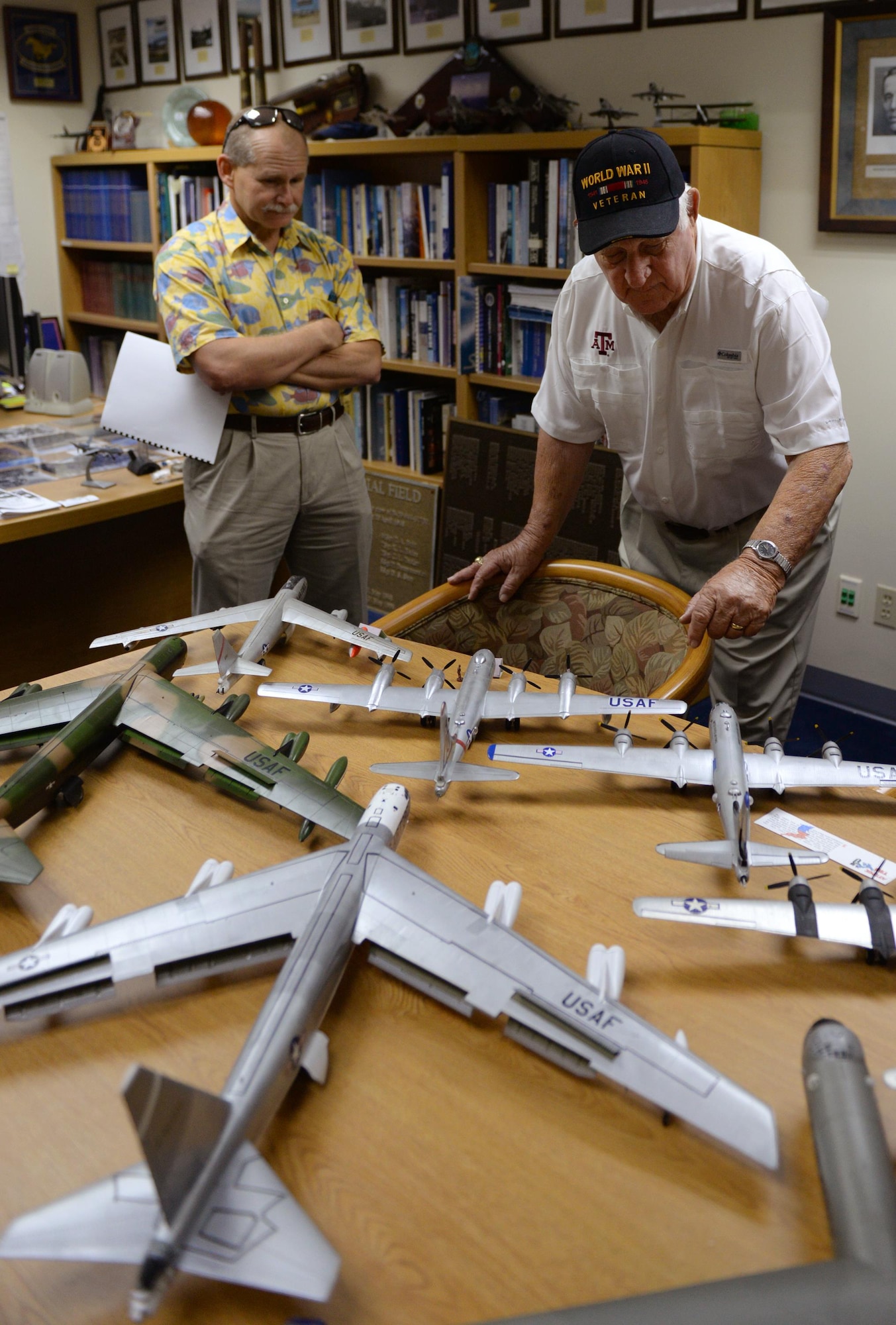 Rowland Ball, a World War II veteran, looks at an assortment of model aircraft during a visit to Andersen Air Force Base, Guam, Aug. 16, 2016. Ball served in the United States Army Air Corps as a B-29 Superfortress navigator during the tail end of World War II, where he flew 27 missions out of Guam. (U.S. Air Force photo by Staff Sgt. Benjamin Gonsier)