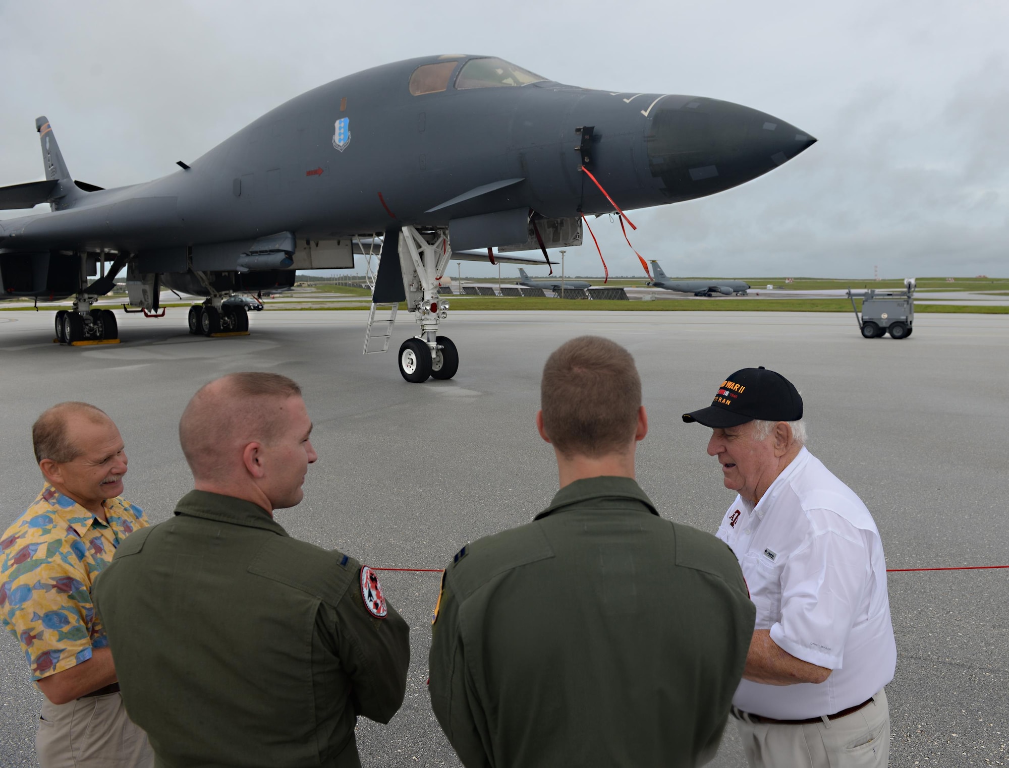 Rowland Ball, a World War II veteran, shares a story with Airmen during a visit to Andersen Air Force Base, Guam, Aug. 16, 2016. Ball was a B-29 Superfortress navigator who flew in 27 missions out of Guam. During his visit to Andersen AFB, he received the unique opportunity to see the bombers that arrived after the B-29: the B-52 Stratofortress, B-1B Lancer and B-2 Spirit. (U.S. Air Force photo by Staff Sgt. Benjamin Gonsier)  