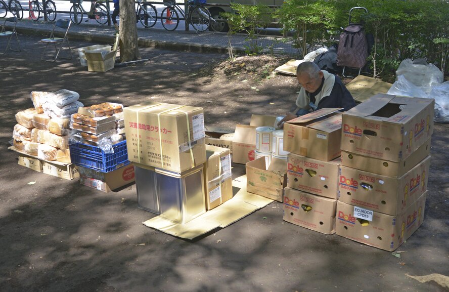 A member of a local church prepares food for homeless people at Ueno Park, Tokyo, Japan, Aug. 19, 2016. The Yokota Air Base Chapel has worked with local churches for approximately 10 years to provide help for homeless people. (U.S. Air Force photo by Senior Airman David Owsianka/Released)
