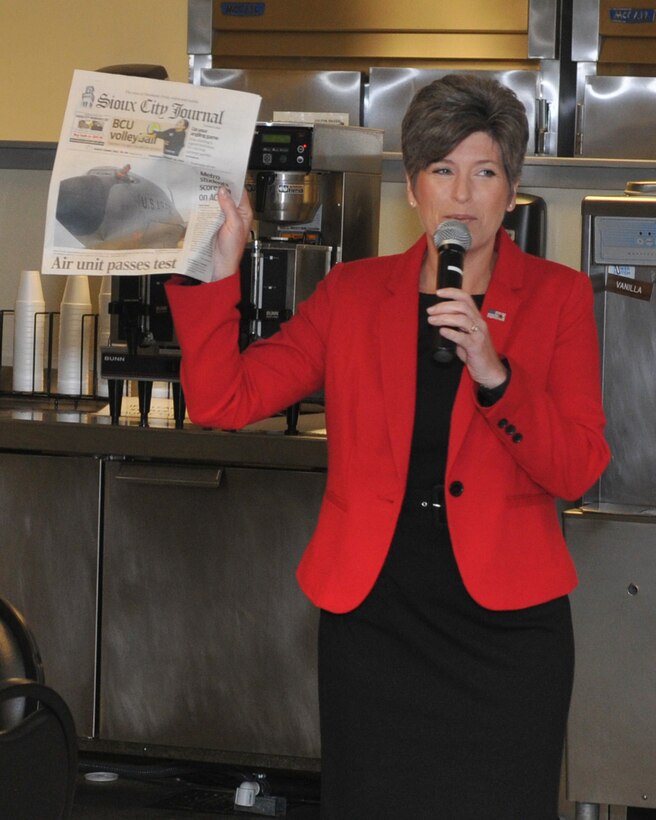 U.S. Senator Joni Ernst (R-Iowa) holds up a copy of today’s Sioux City Journal featuring the 185th Air Refueling Wing on the front page during a visit to the 185th ARW, in Sioux City, Iowa on August 25th, 2016.  Ernst held a town hall meeting with unit members where she congratulated them for successfully completing a unit readiness inspection earlier this week.  (U.S. Air National Guard photo by Tech Sgt. Bill Wiseman/Released)