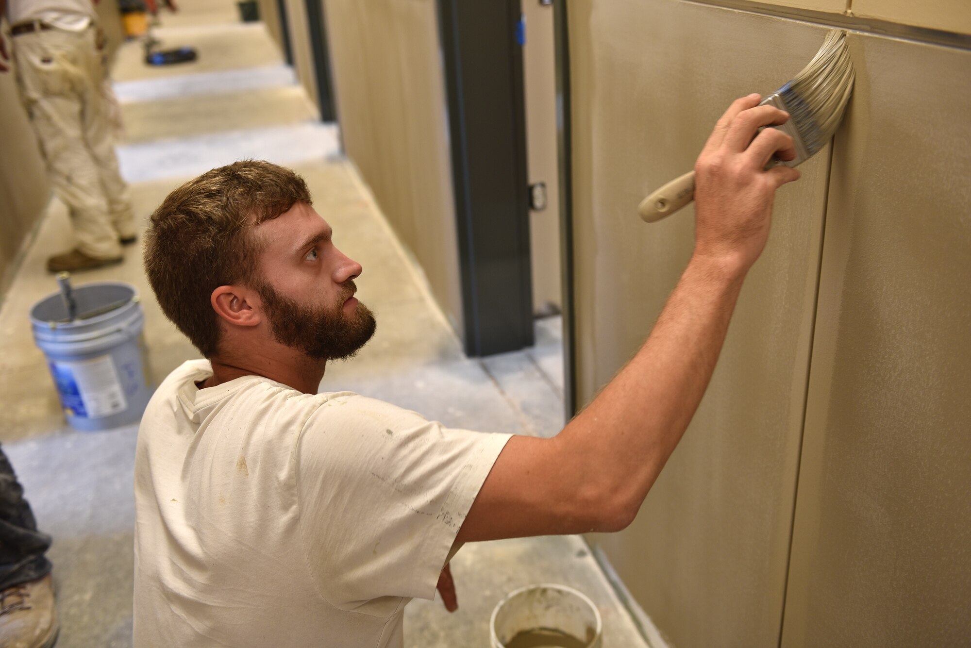 A paint crew makes progress here August 25, 2016, in a hallway on the first floor of the dormitory building under construction at the I.G. Brown Training and Education Center on McGhee Tyson Air National Guard Base in Louisville, Tenn. The painters were busy throughout the summer. The lower wall color is named Sycamore Tan and the upper color is Bittersweet Stem. (U.S. Air National Guard photo by Master Sgt. Mike R. Smith)