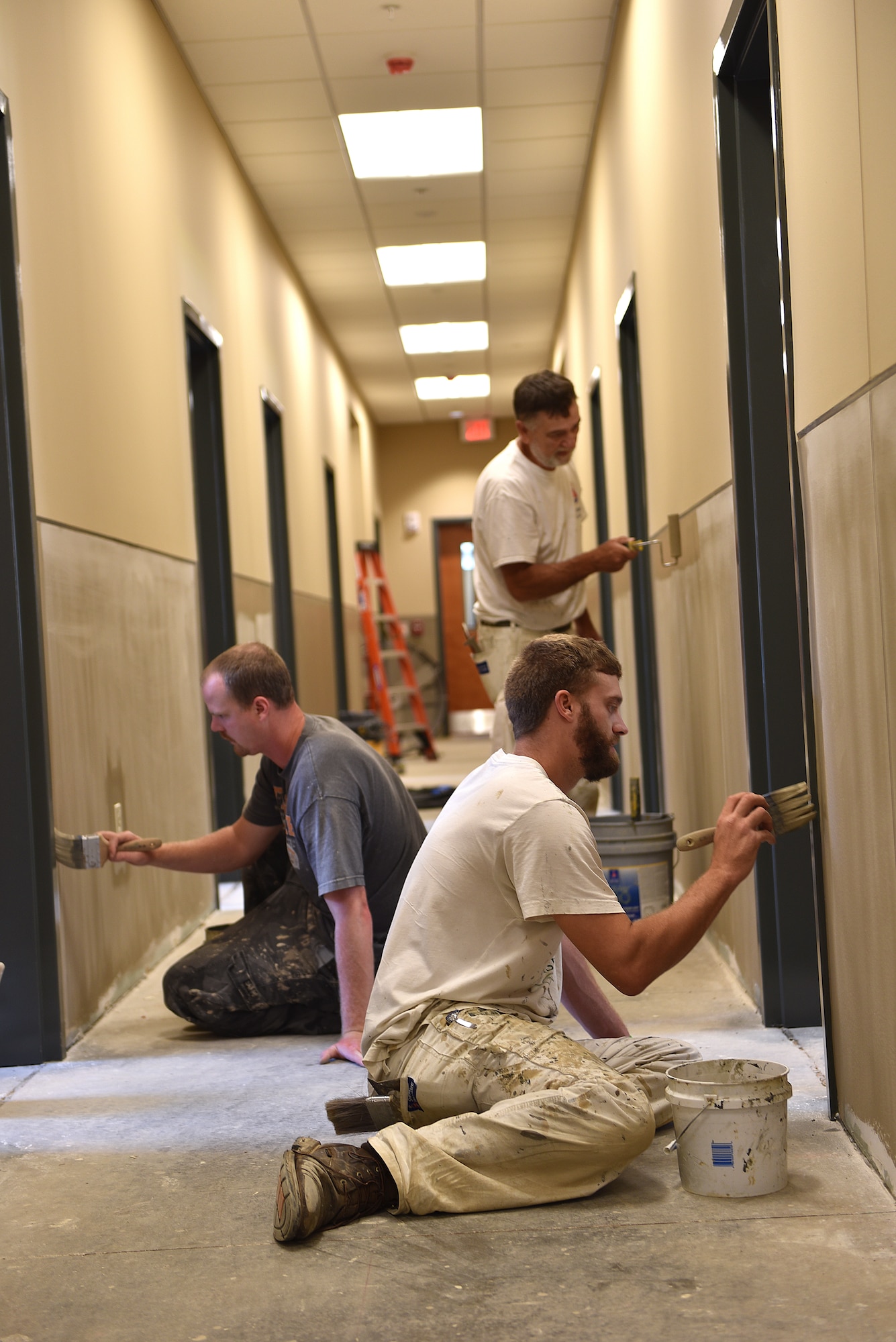 A paint crew makes progress here August 25, 2016, in a hallway on the first floor of the dormitory building under construction at the I.G. Brown Training and Education Center on McGhee Tyson Air National Guard Base in Louisville, Tenn. The painters were busy throughout the summer. The lower wall color is named Sycamore Tan and the upper color is Bittersweet Stem. (U.S. Air National Guard photo by Master Sgt. Mike R. Smith)