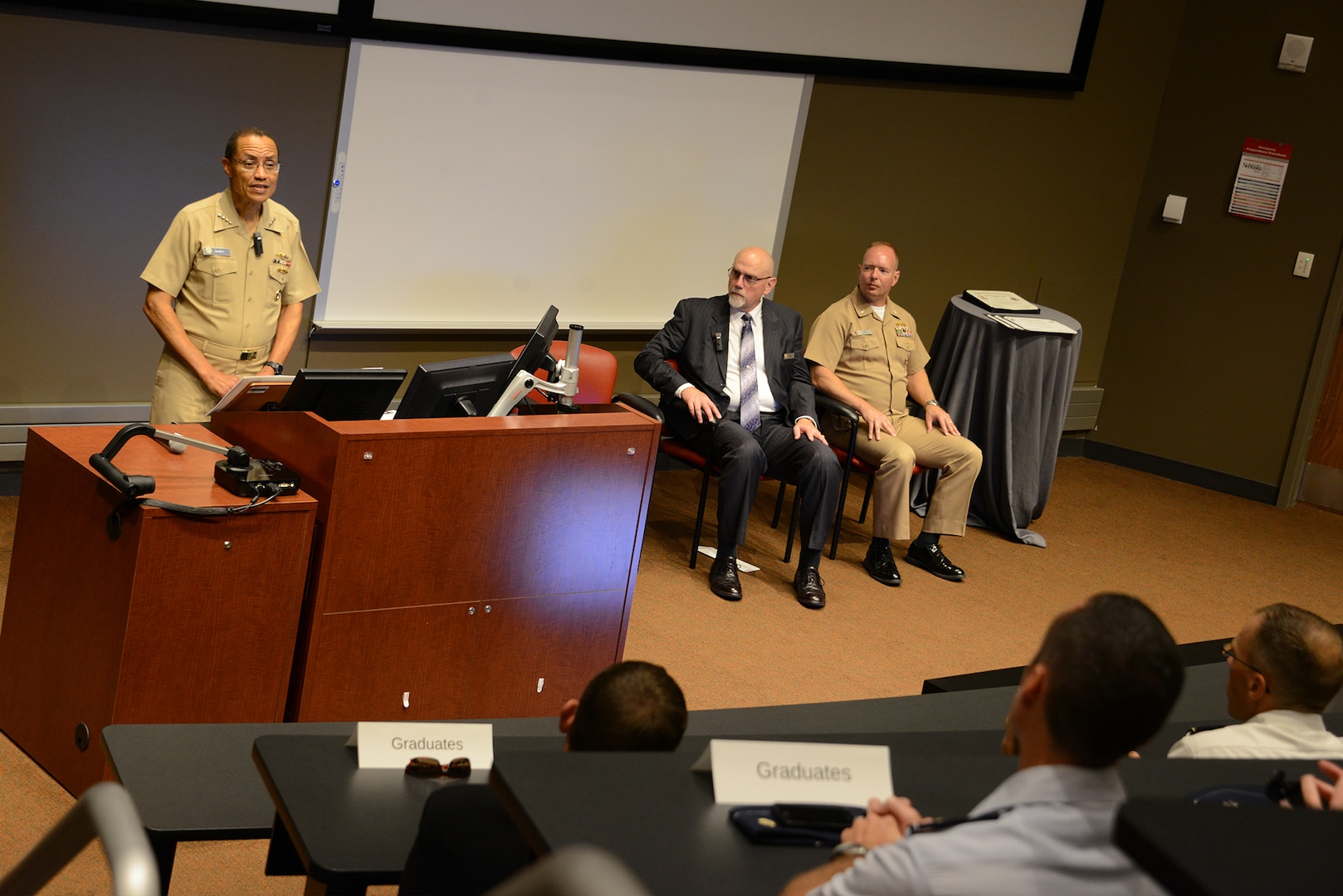 Adm. Cecil D. Haney, U.S. Strategic Command (USSTRATCOM) commander, provides the keynote speech during a graduation ceremony at the University of Nebraska at Omaha's (UNO) Mammel Hall in Omaha, Neb., Aug. 25, 2016. In his remarks, Haney congratulated 18 Soldiers, Sailors, Airmen, Marines and Department of Defense (DoD) civilians who were recognized for completing the first 10-week Joint and Combined Warfighting School satellite course at UNO. The course is the second of its kind - the pilot non-resident satellite JPME Phase II course in Tampa, Fla., was approved by Congress and launched in January 2013 - and represents the third option for field grade officers seeking JPME Phase II credit. Prior to the satellite courses, JPME Phase II courses were only offered at the National Defense University's Joint Forces Staff College (JFSC) in Norfolk, Va.  One of nine DoD unified combatant commands, USSTRATCOM has global strategic missions assigned through the Unified Command Plan, which include strategic deterrence; space operations; cyberspace operations; joint electronic warfare; global strike; missile defense; intelligence, surveillance and reconnaissance; combating weapons of mass destruction; and analysis and targeting. (USSTRATCOM photo by U.S. Air Force Staff Sgt. Jonathan Lovelady)