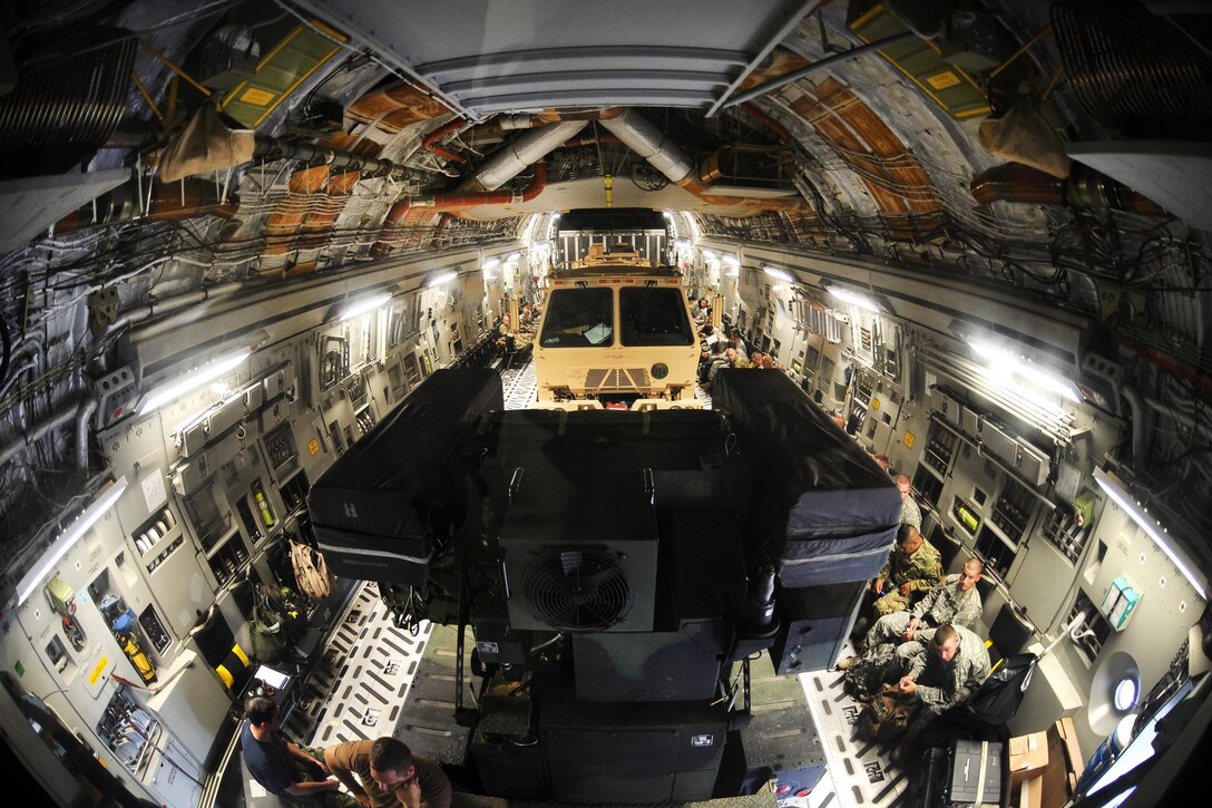 U.S. and Canadian soldiers wait for takeoff after uploading an Avenger air defense system, which uses surface-to-air missiles to provide protection for ground units, onto a Canadian air force Globemaster III aircraft in Greenville, S.S., Aug. 13, 2016. Army National Guard photo by Staff Sgt. Roby Di Giovine

