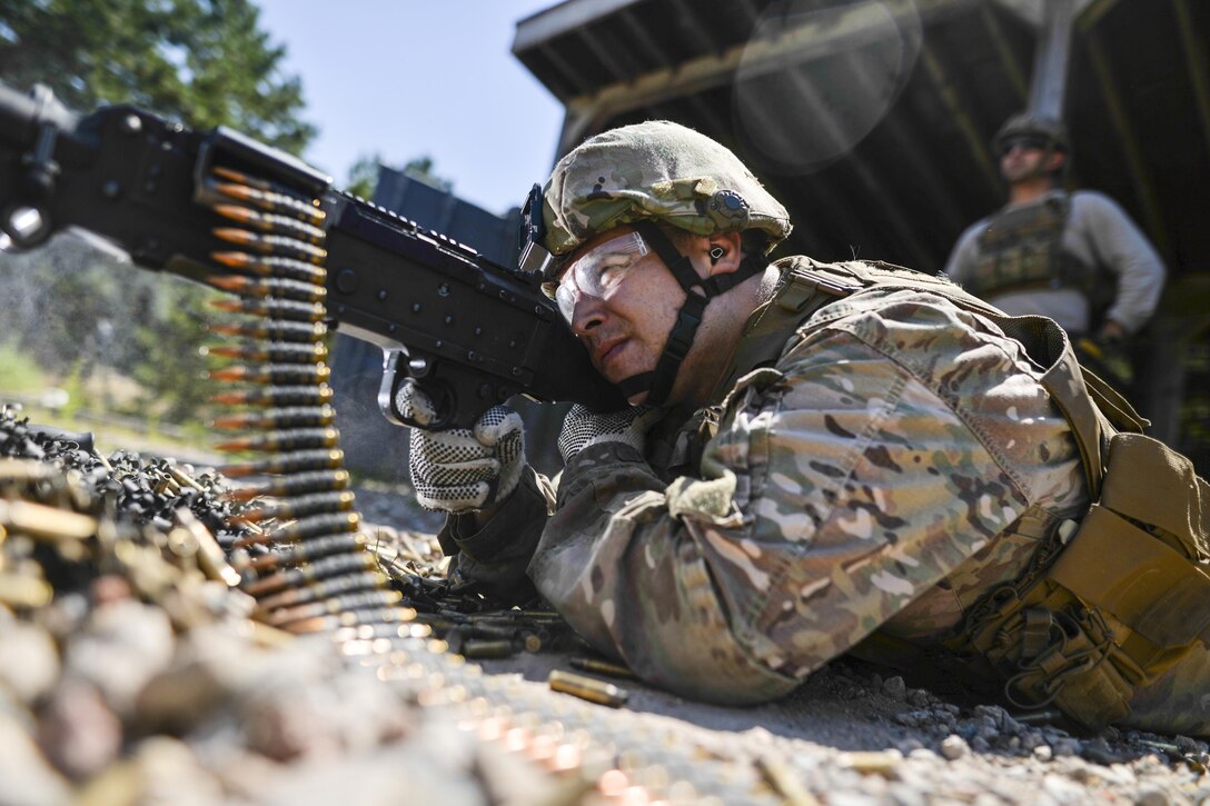 Air Force Staff Sgt. Robert Converse fires the M240 machine gun during a training event at the Suffolk County Range in Westhampton Beach, N.Y., Aug. 24, 2016. Converse is assigned to the New York National Guard's 106th Rescue Wing. Air National Guard photo by Staff Sgt. Christopher S. Muncy