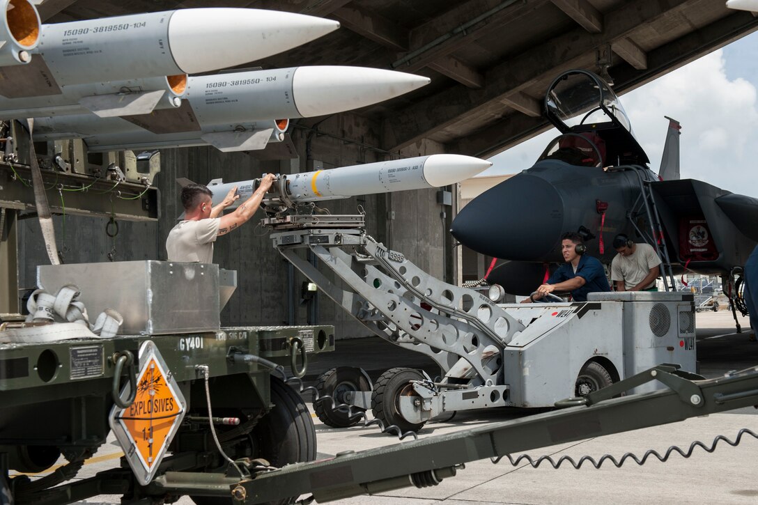 Maintainers from the 18th Aircraft Maintenance Squadron and pilots assigned to the 44th and 67th Fighter Squadrons conduct a mass aircraft generation exercise Aug. 22 and 23, at Kadena Air Base, Japan. Maintainers loaded AIM-9 sidewinder missiles, AIM-120 advanced medium-range air-to-air missiles, flares, and M-61A1 cannon rounds onto F-15 Eagles, before the aircraft taxied and were dispersed around the flight line. Kadena participates in a variety of routine training exercises throughout the year to maintain a consistent high standard of readiness and expertise. F-15s assigned to Kadena Air Base taxied on the flight line during a training exercise Aug. 23 while loaded with live ammunition. This training was not in response to or in anticipation of any regional concerns. While no planes took off from the flightline, this routine exercise helped ensure Kadena’s ability to provide air superiority in the defense of Japan and promoting peace and stability throughout the Indo-Asia-Pacific region. (U.S. Air Force photo by Senior Airman Peter Reft/Released)
