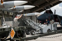 Maintainers from the 18th Aircraft Maintenance Squadron and pilots assigned to the 44th and 67th Fighter Squadrons conduct a mass aircraft generation exercise Aug. 22 and 23, at Kadena Air Base, Japan. Maintainers loaded AIM-9 sidewinder missiles, AIM-120 advanced medium-range air-to-air missiles, flares, and M-61A1 cannon rounds onto F-15 Eagles, before the aircraft taxied and were dispersed around the flight line. Kadena participates in a variety of routine training exercises throughout the year to maintain a consistent high standard of readiness and expertise. F-15s assigned to Kadena Air Base taxied on the flight line during a training exercise Aug. 23 while loaded with live ammunition. This training was not in response to or in anticipation of any regional concerns. While no planes took off from the flightline, this routine exercise helped ensure Kadena’s ability to provide air superiority in the defense of Japan and promoting peace and stability throughout the Indo-Asia-Pacific region. (U.S. Air Force photo by Senior Airman Peter Reft/Released)
